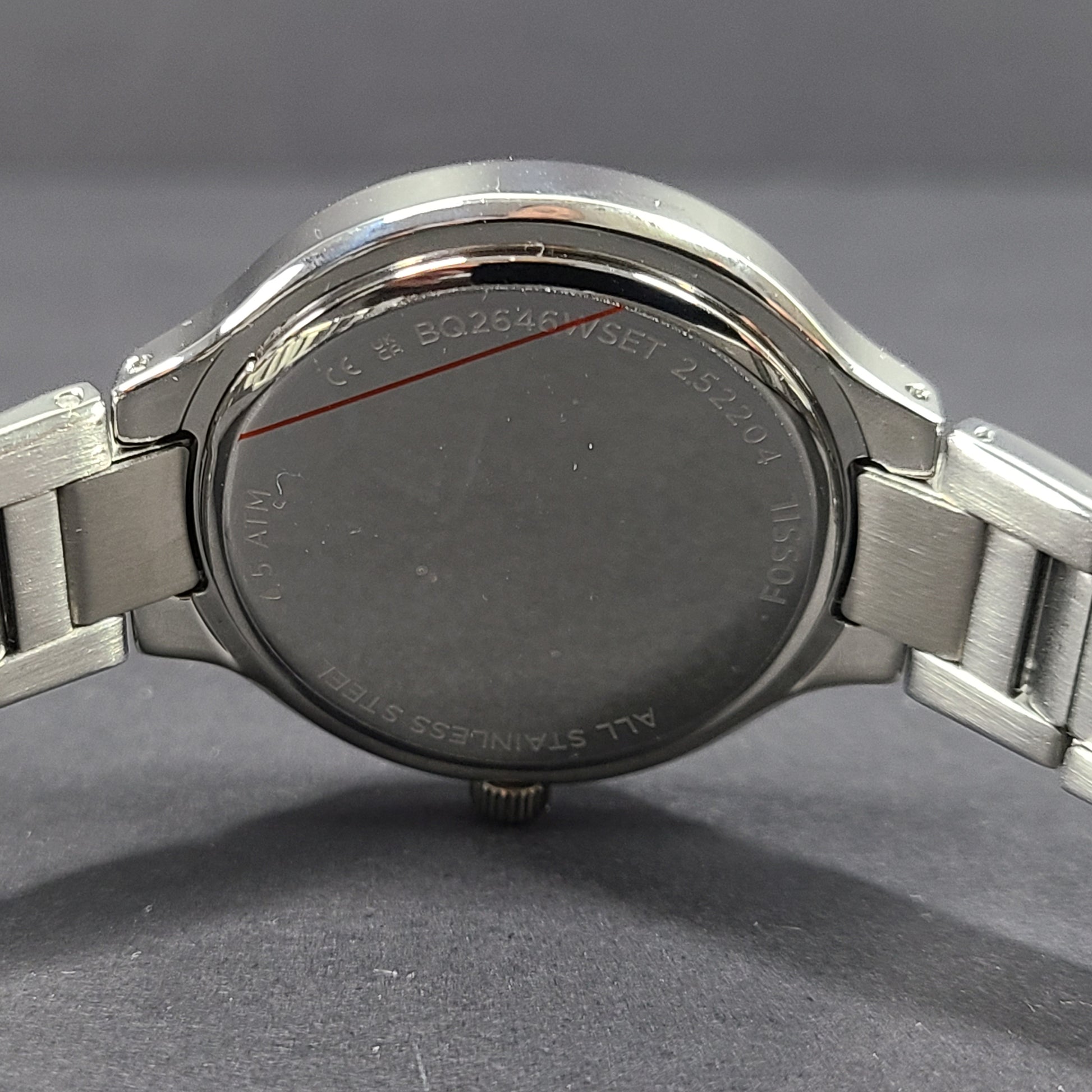 Sleek stainless-steel Fossil wristwatch with a blue dial and a slim 9mm case.