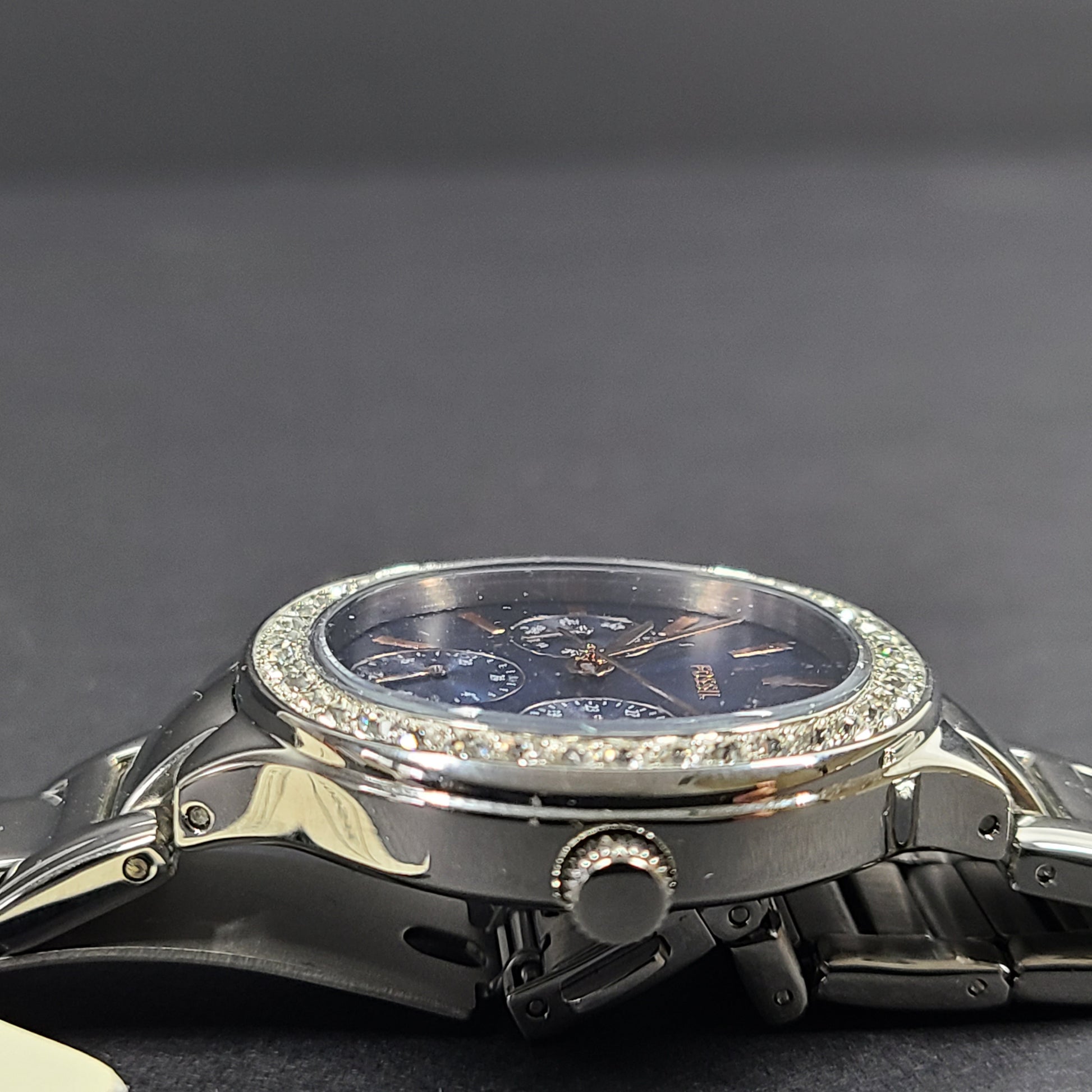 Sleek stainless-steel Fossil wristwatch with a blue dial and a slim 9mm case.