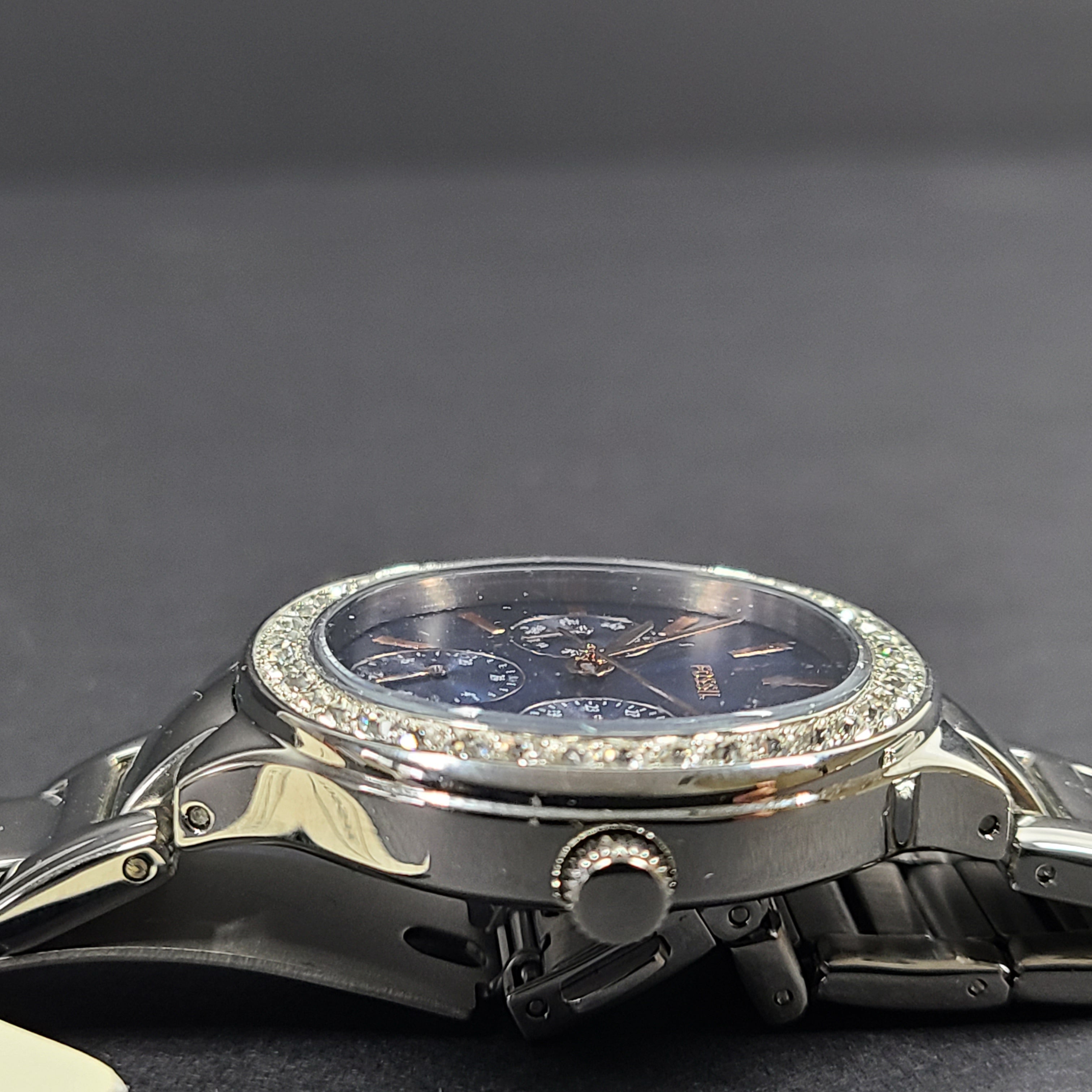 Sleek stainless-steel Fossil wristwatch with a blue dial and a slim 9mm case.