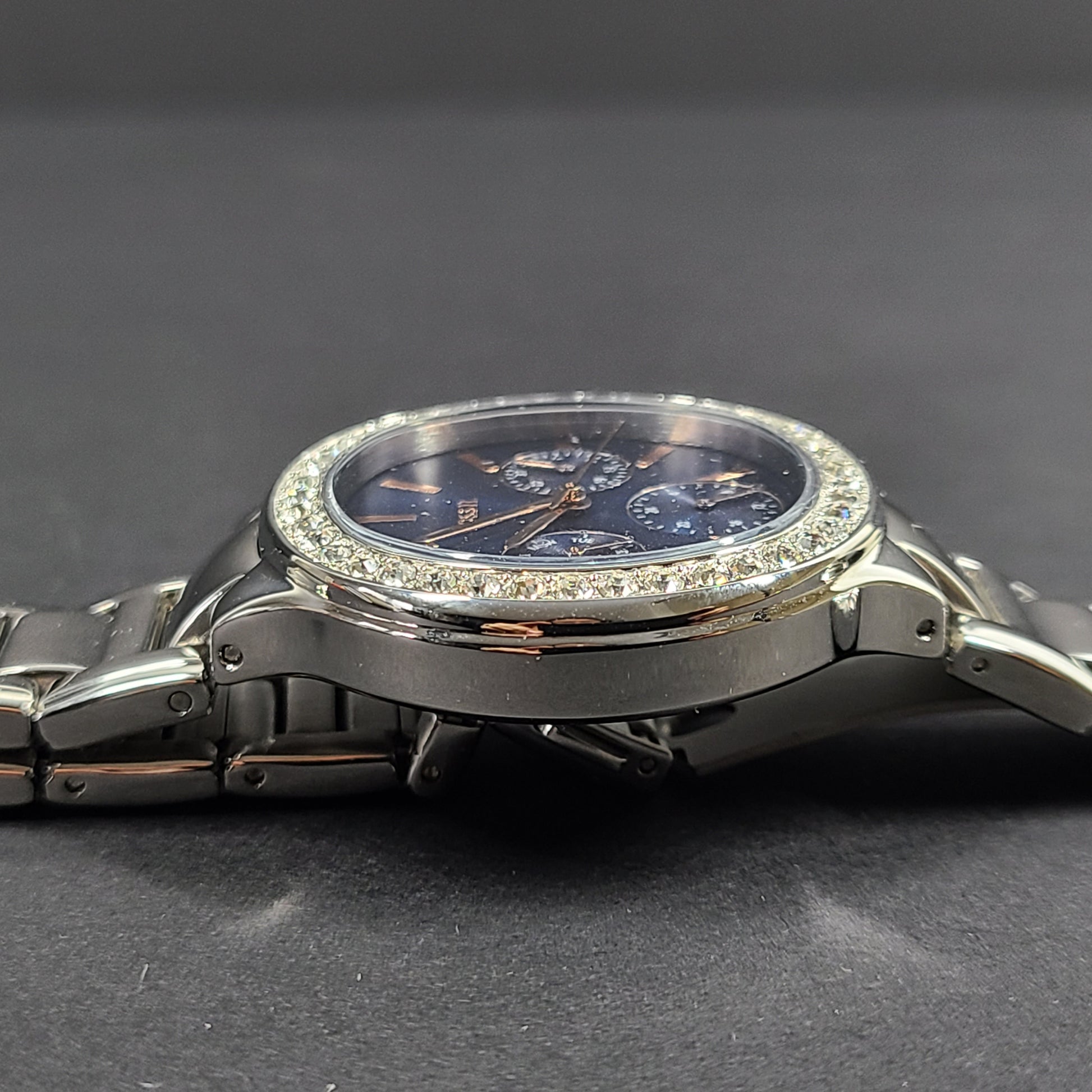 Sleek stainless-steel Fossil wristwatch with a blue dial and a slim 9mm case.