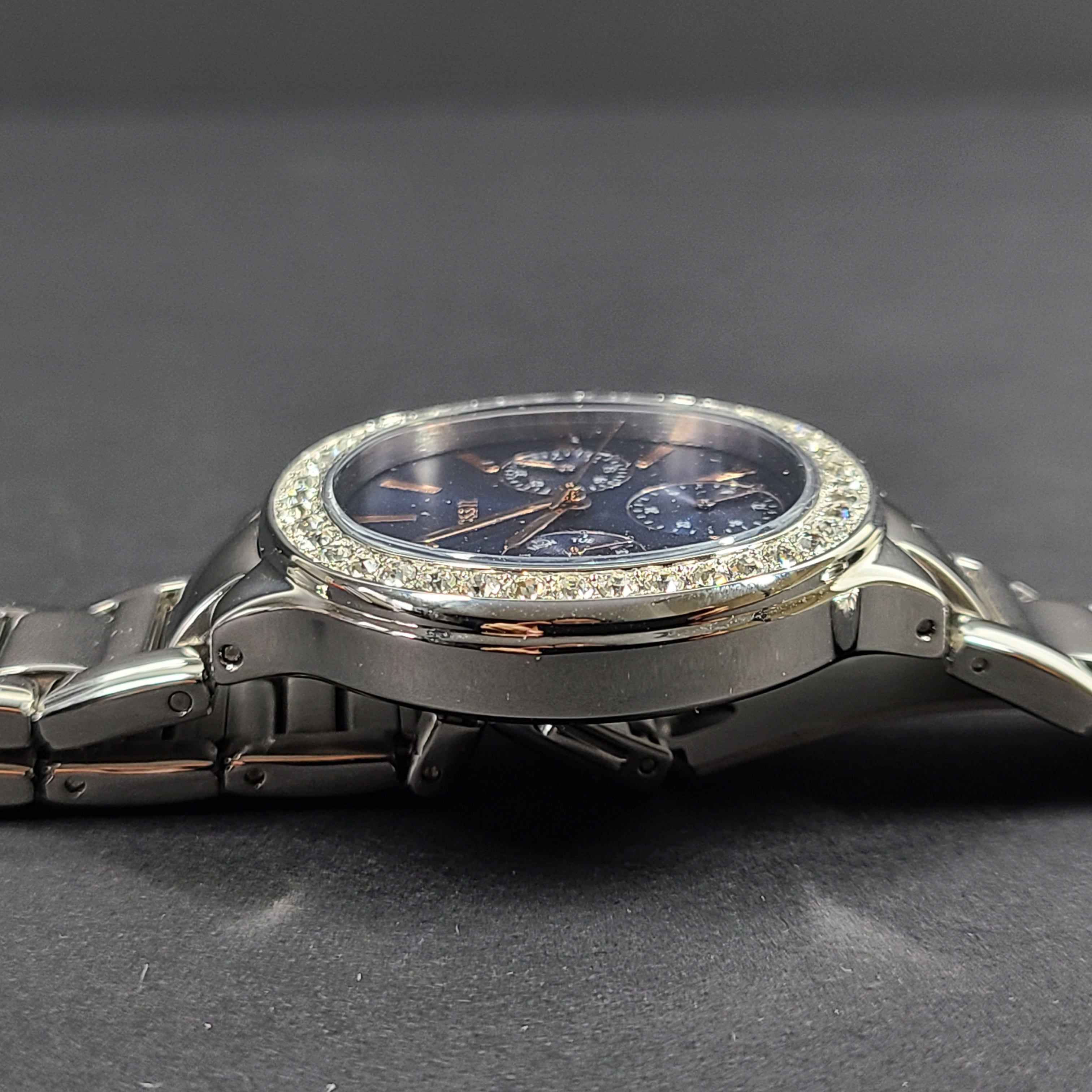 Sleek stainless-steel Fossil wristwatch with a blue dial and a slim 9mm case.