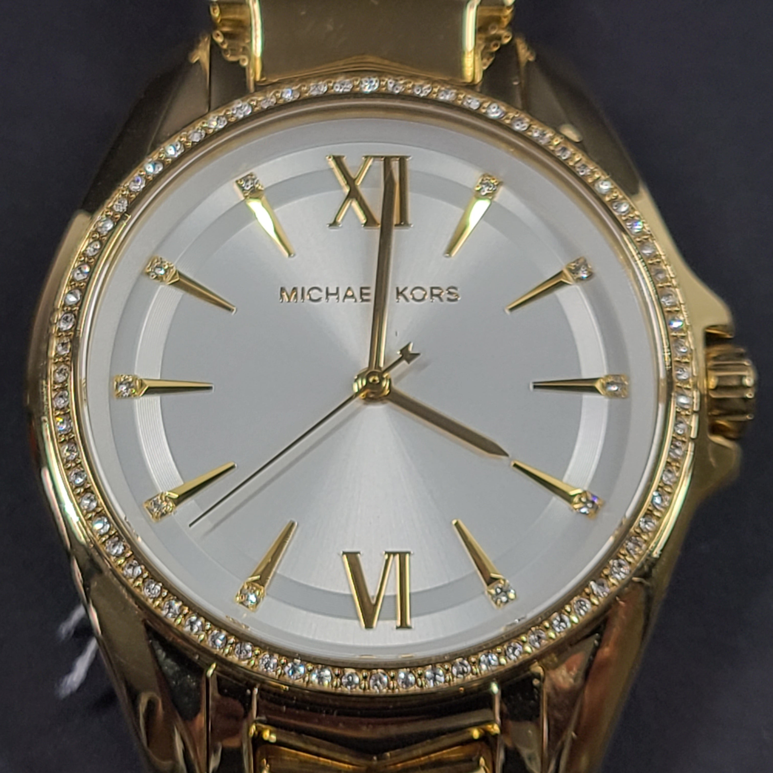 Gold-tone Michael Kors MK6692 women's analog stainless steel watch with white dial and linked bracelet.