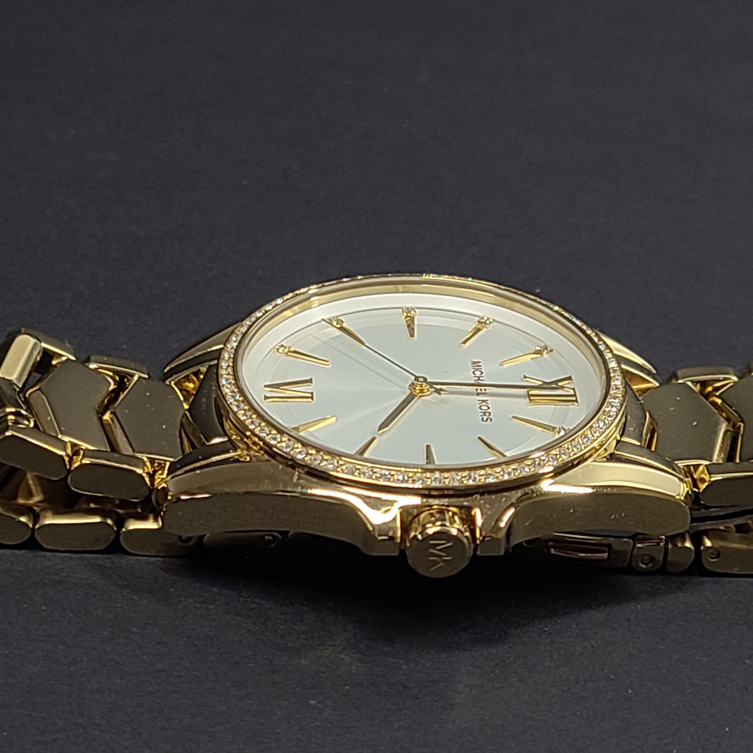 Gold-tone Michael Kors MK6692 women's analog stainless steel watch with white dial and linked bracelet.