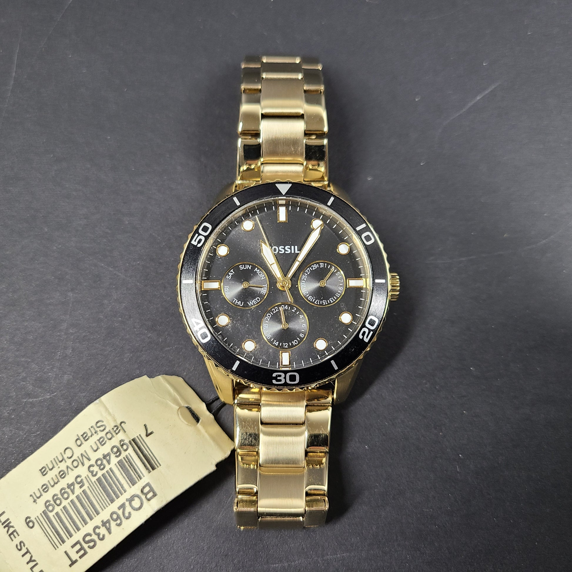 Gold-tone stainless steel his-and-her multifunction watch set with black sunray dials and interchangeable straps.
