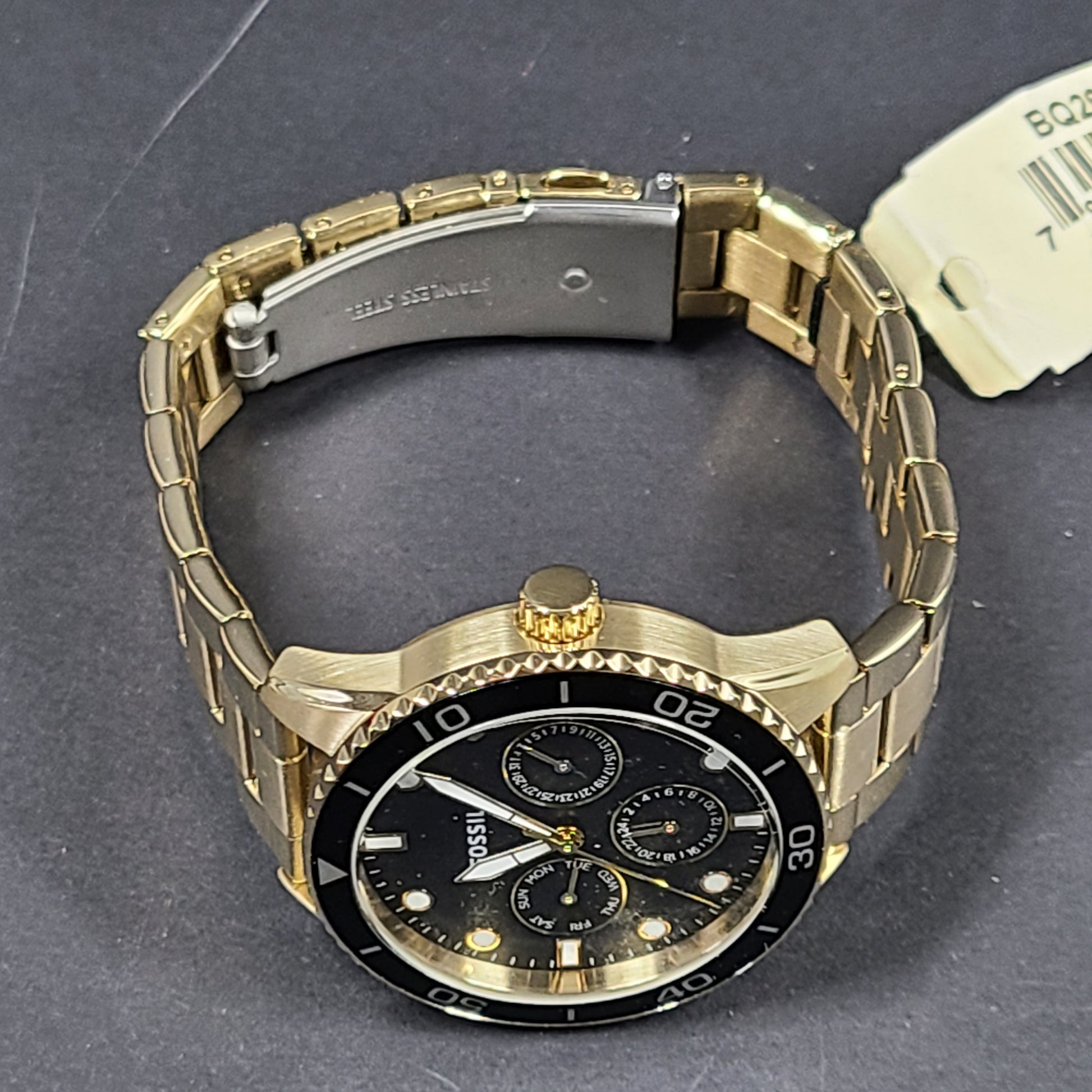 Gold-tone stainless steel his-and-her multifunction watch set with black sunray dials and interchangeable straps.