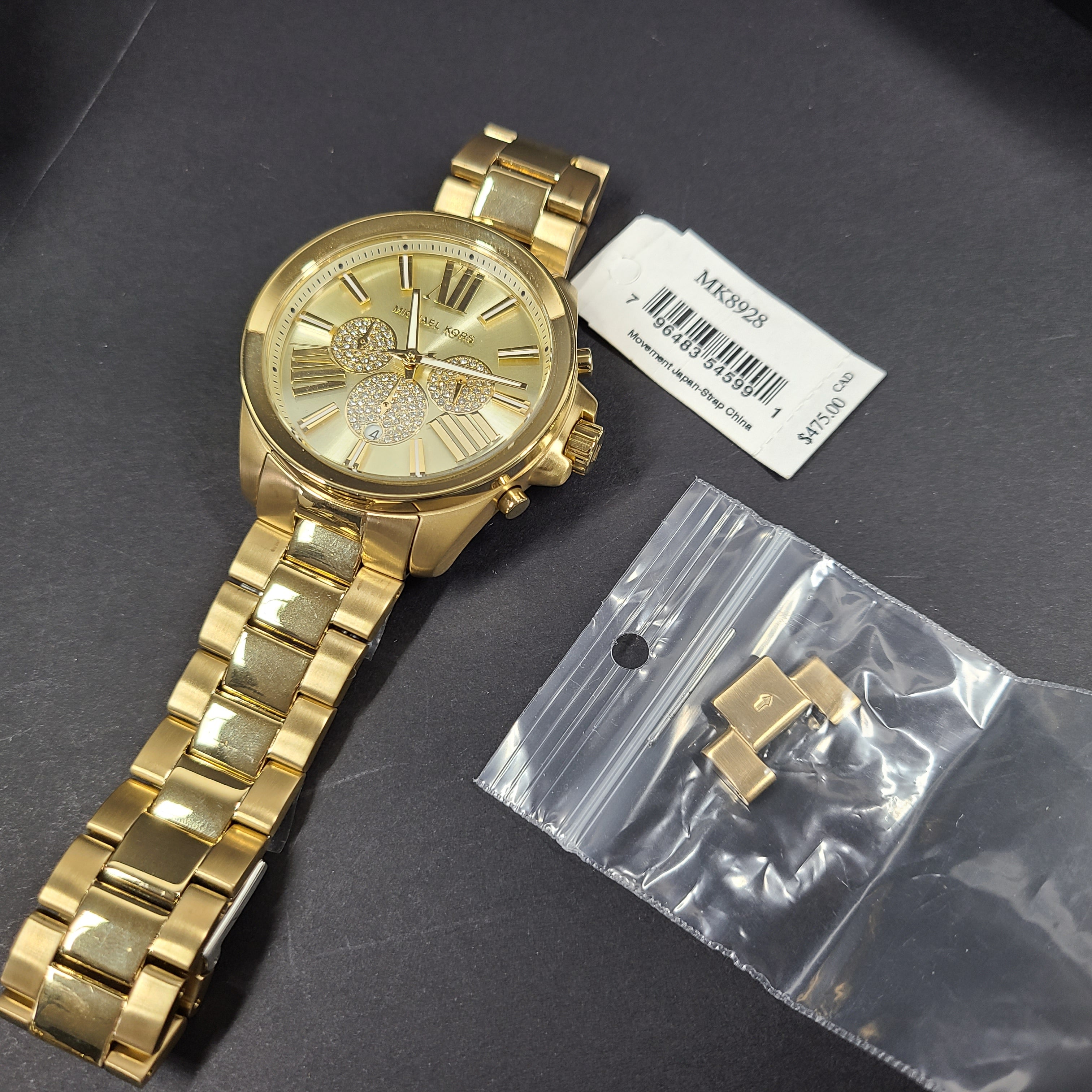 Gold-tone Michael Kors Wren chronograph watch with stainless steel bracelet and pavé sub-dials.