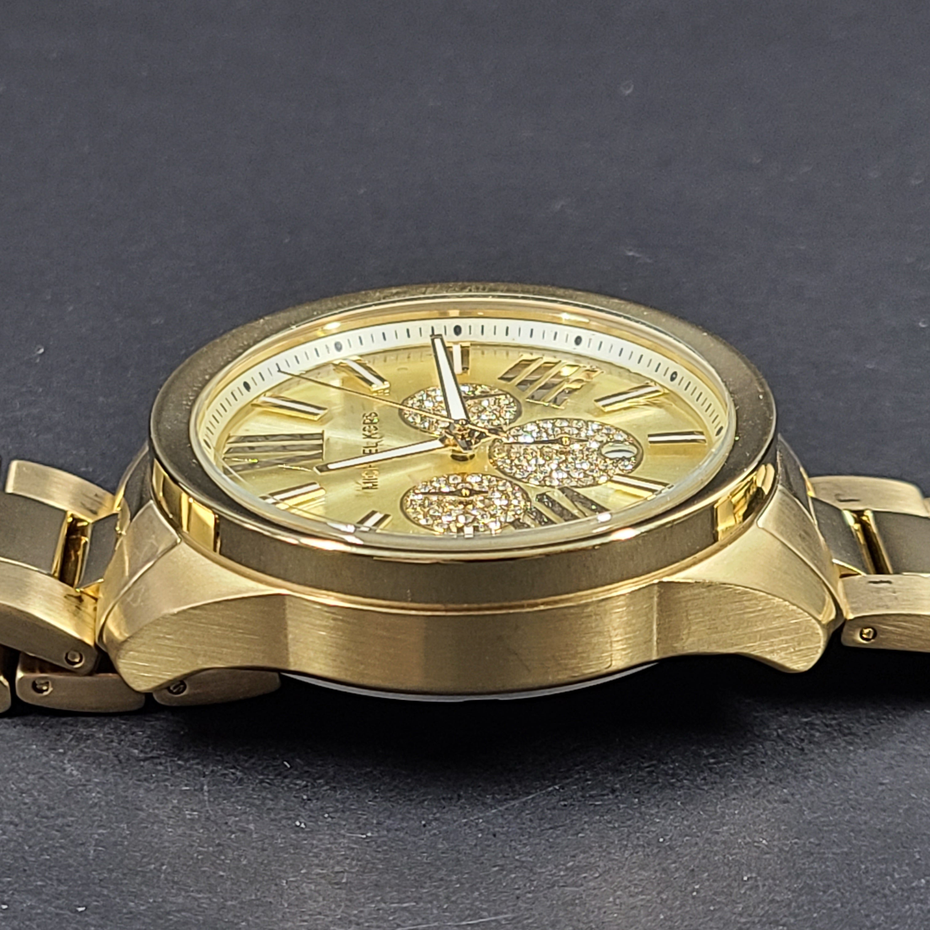 Gold-tone Michael Kors Wren chronograph watch with stainless steel bracelet and pavé sub-dials.