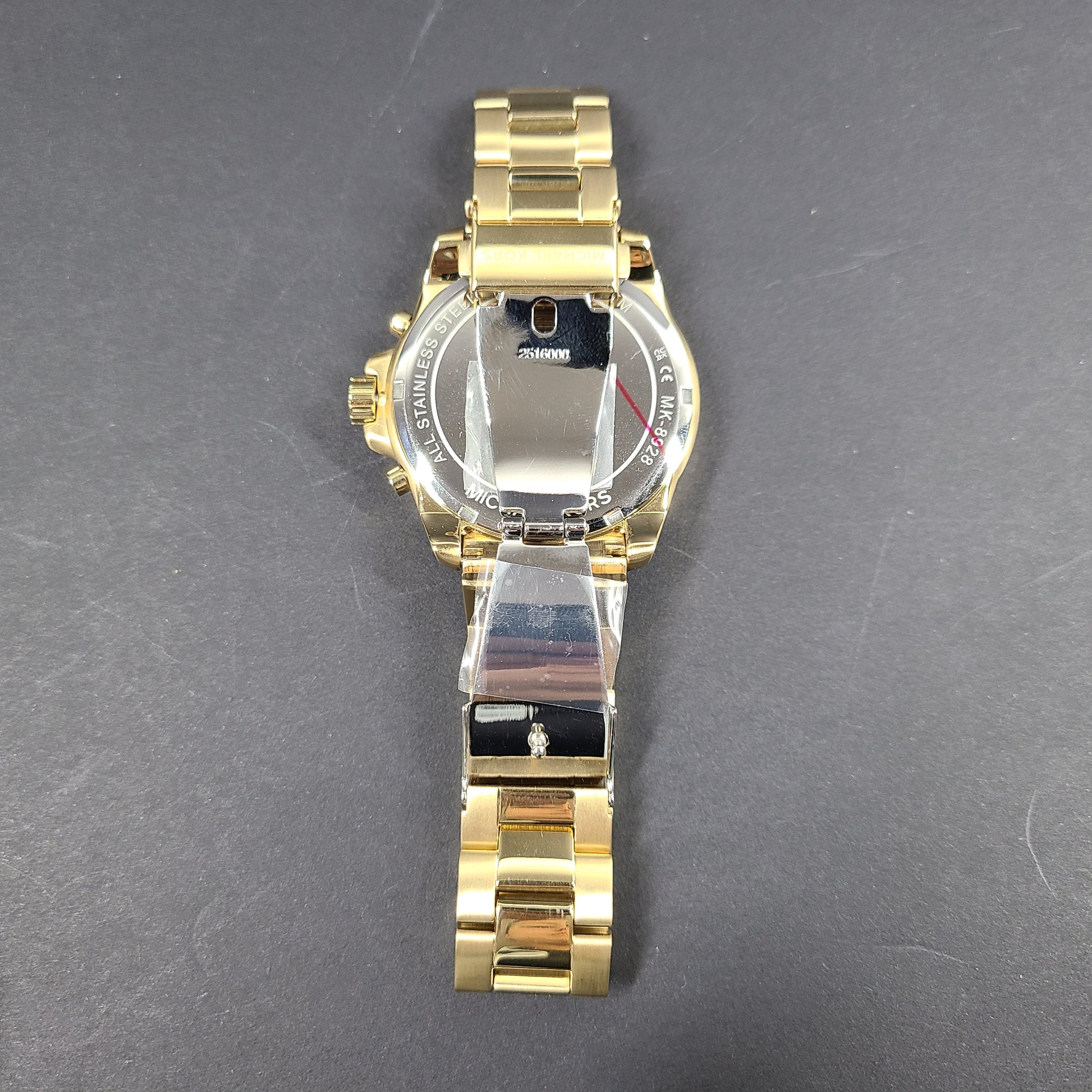 Gold-tone Michael Kors Wren chronograph watch with stainless steel bracelet and pavé sub-dials.