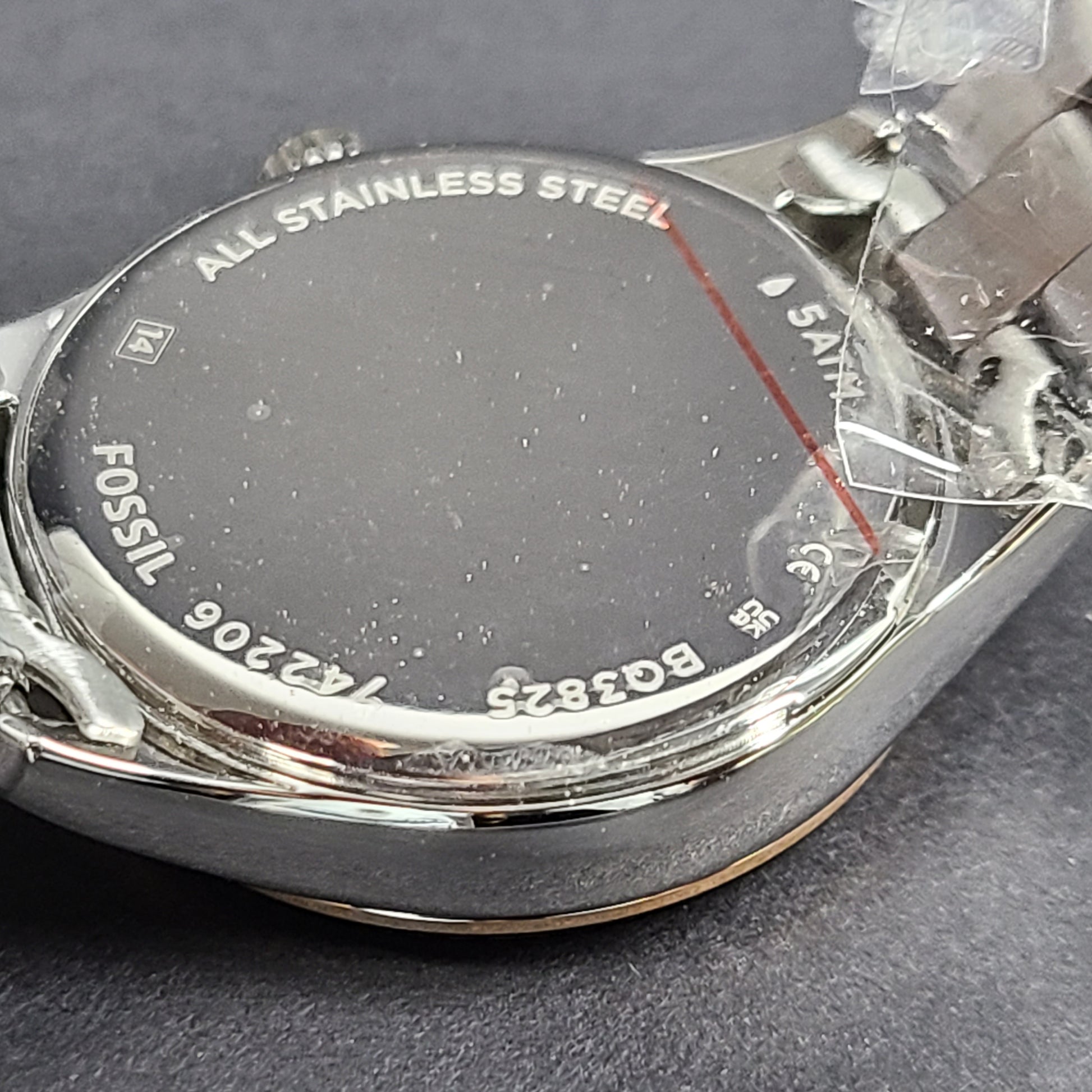 A two-tone Fossil Rye wristwatch with silver and gold stainless-steel bracelet and a date window.