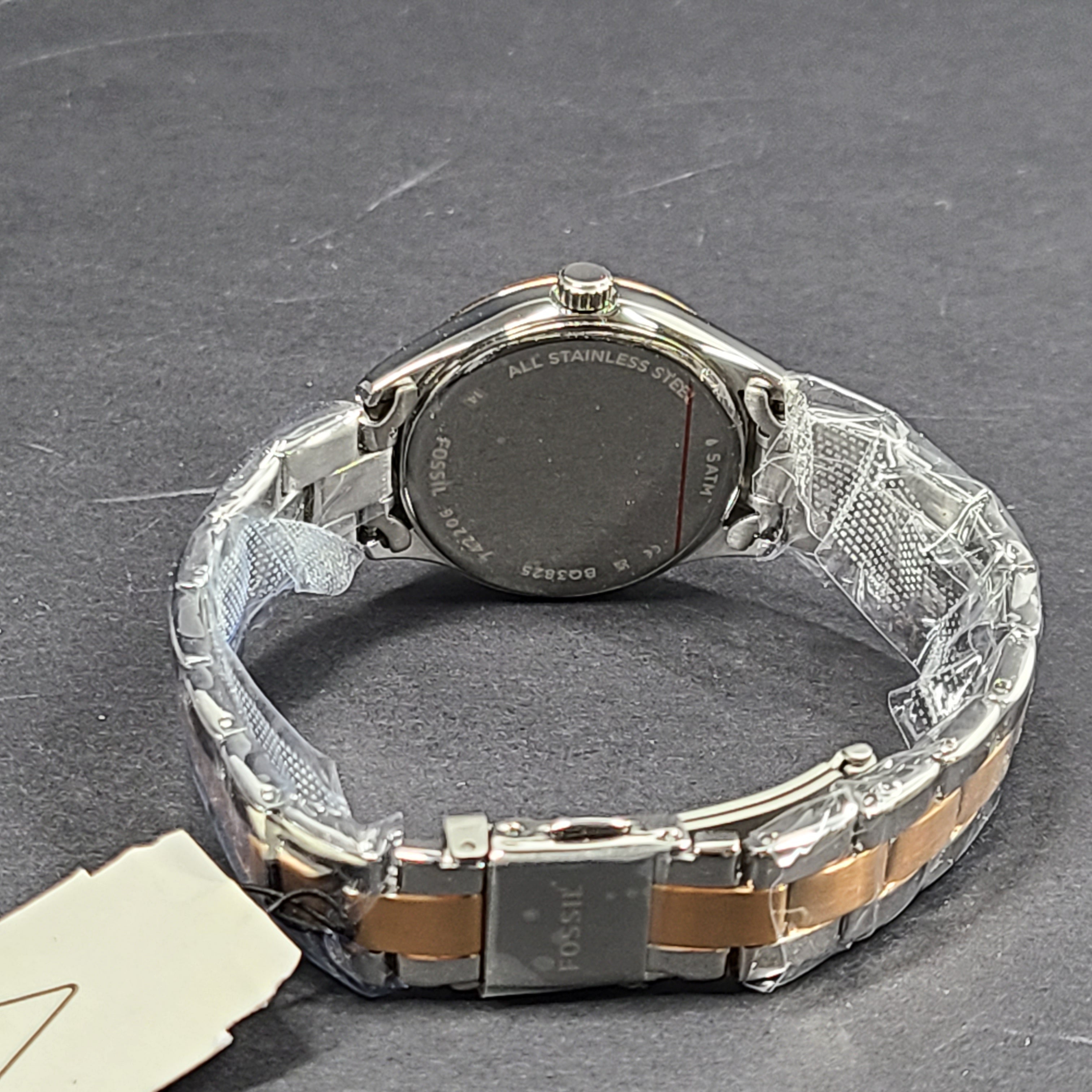 A two-tone Fossil Rye wristwatch with silver and gold stainless-steel bracelet and a date window.