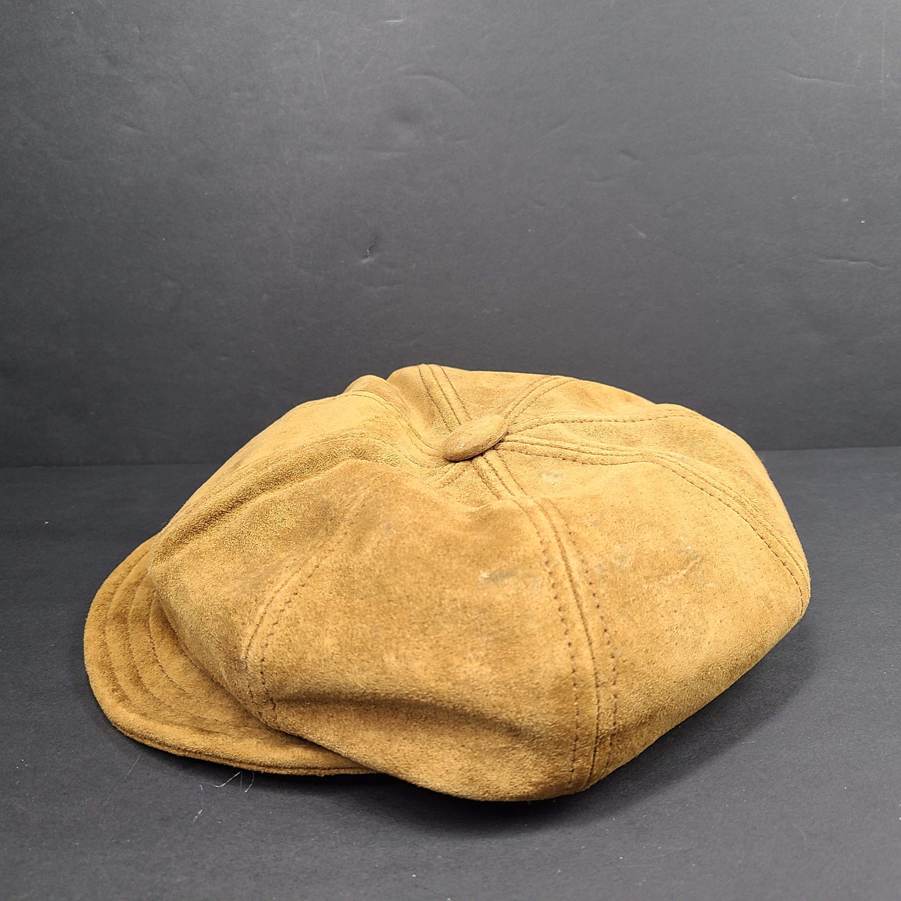 Goorin Bros medium brown suede cap with rounded crown and short brim.