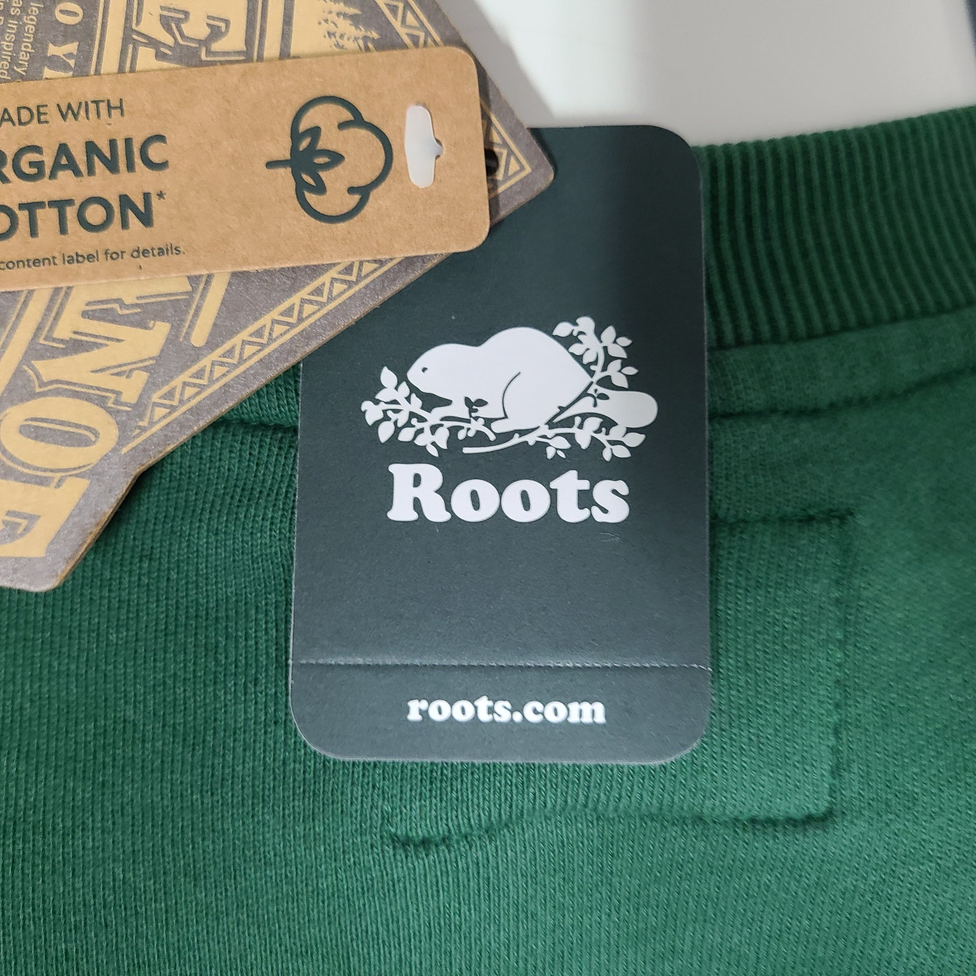 Roots Beaver Canoe Relaxed Crew Sweatshirt in forest green, size XS, with a relaxed crew fit and organic cotton construction.