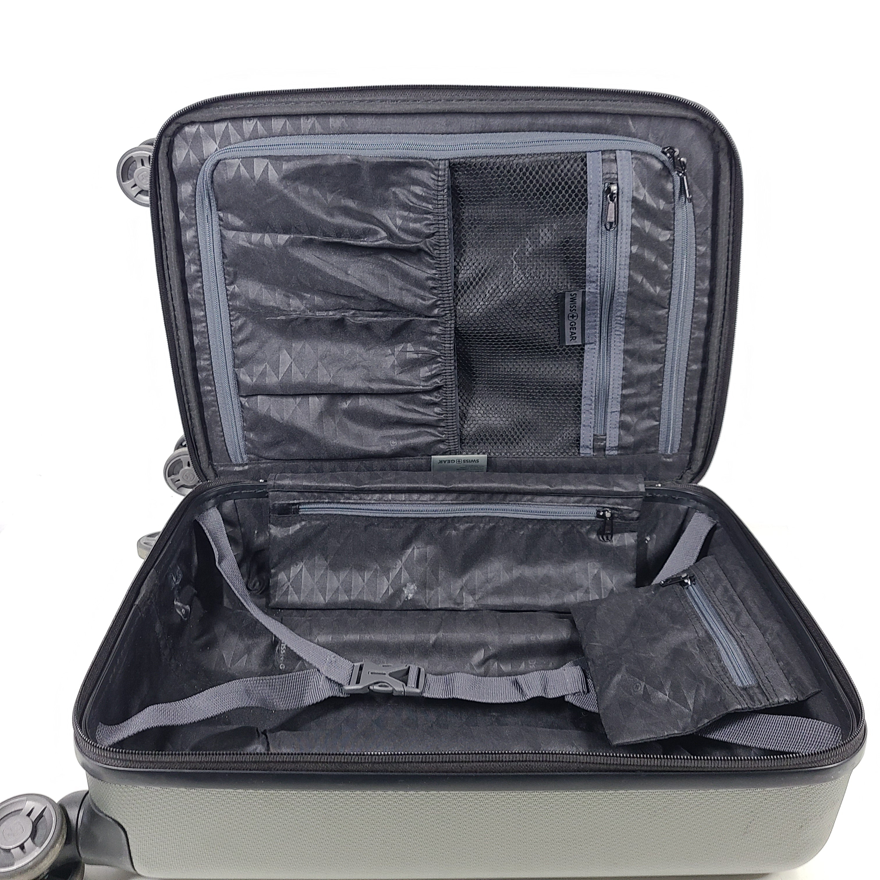 Swiss Gear silver hardside suitcase with embossed logo and light scuffs from regular use.
