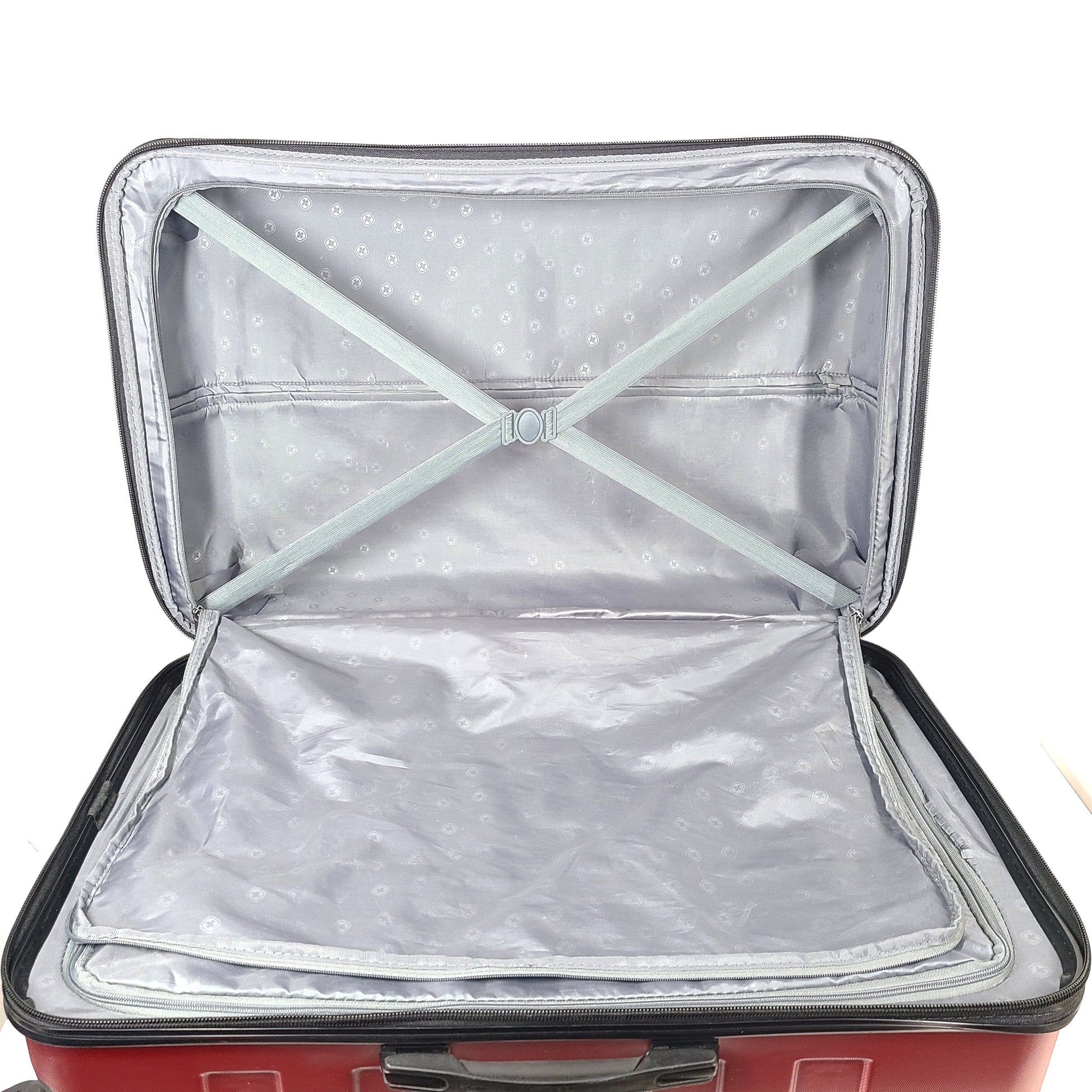 Red SwissGear SW25083 spinner suitcase with four multi-directional wheels and a telescoping handle.