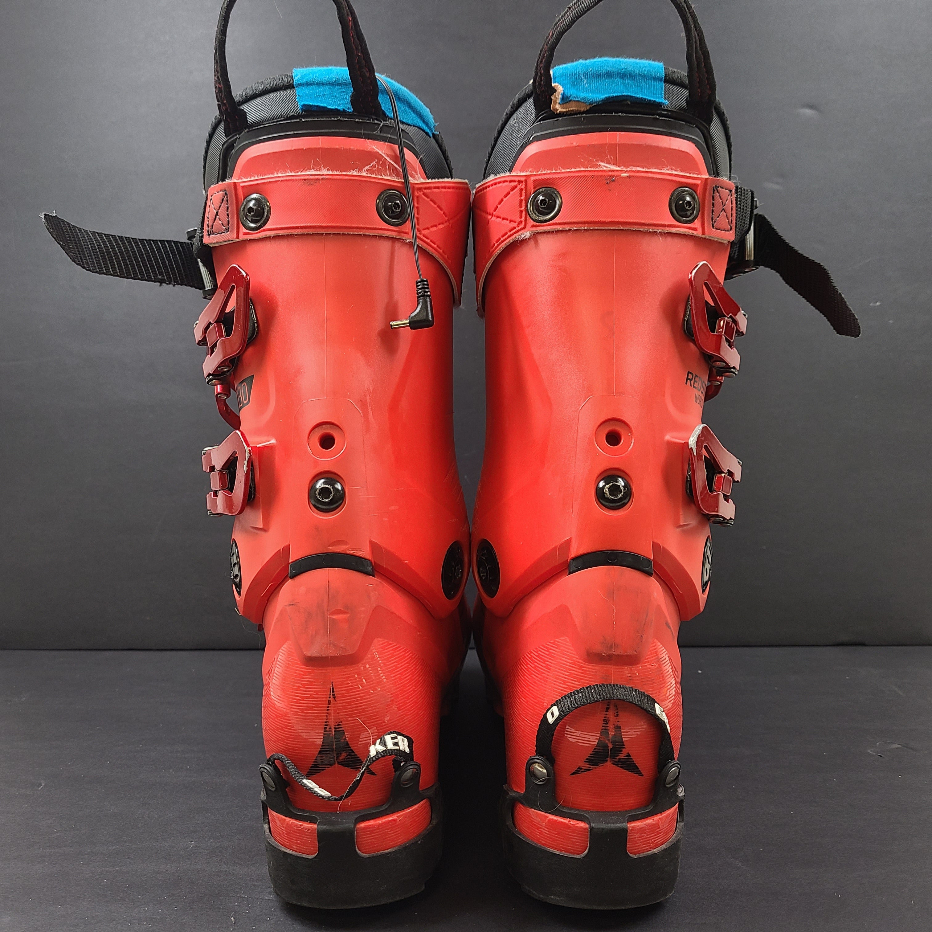 High-performance Atomic Redster World Cup 130 ski boots in red with race-oriented 130 flex and ISO 5355 compatibility.