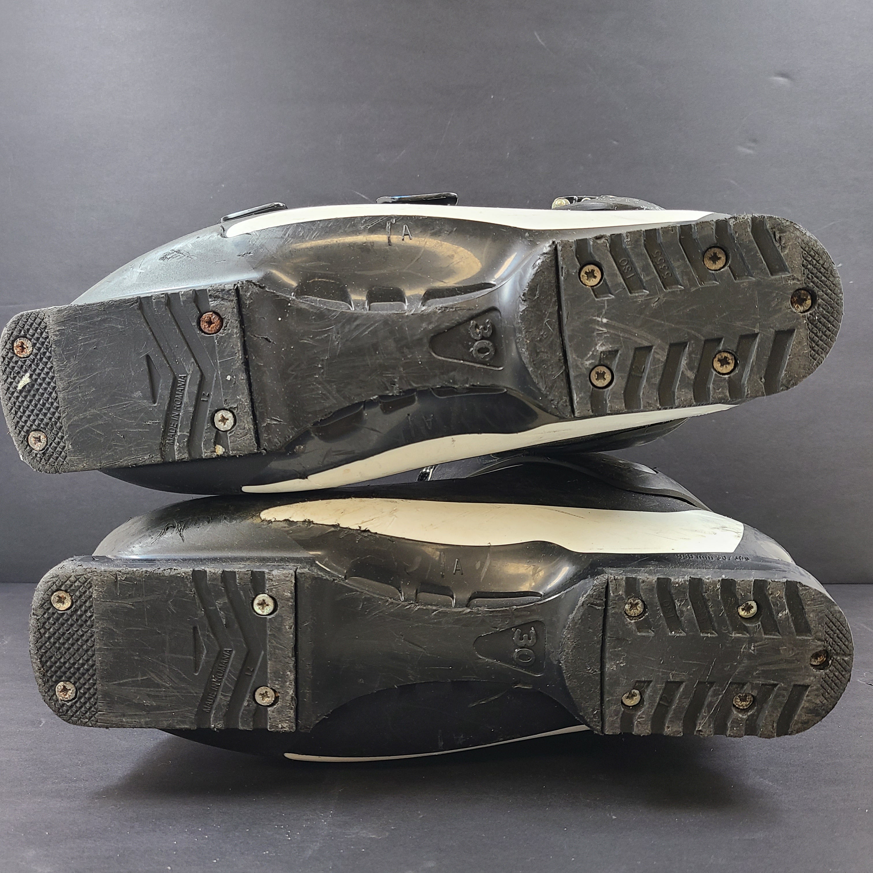 Salomon Mission LX XFit ski boots in black and white for responsive alpine control and comfortable fit.