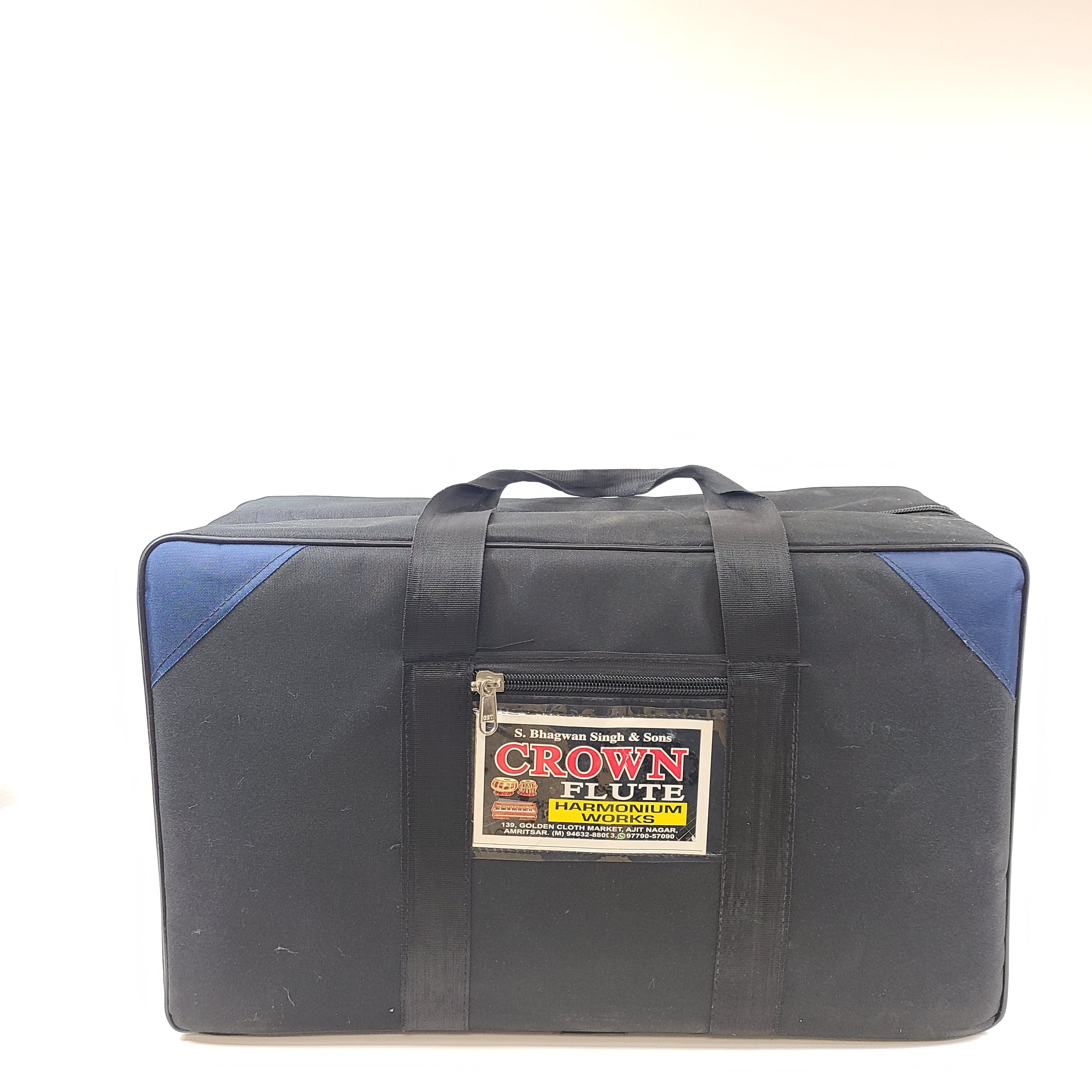 Classic S. Bhagwan Singh & Sons Crown Flute harmonium in black, blue, and brown with a carrying case included.