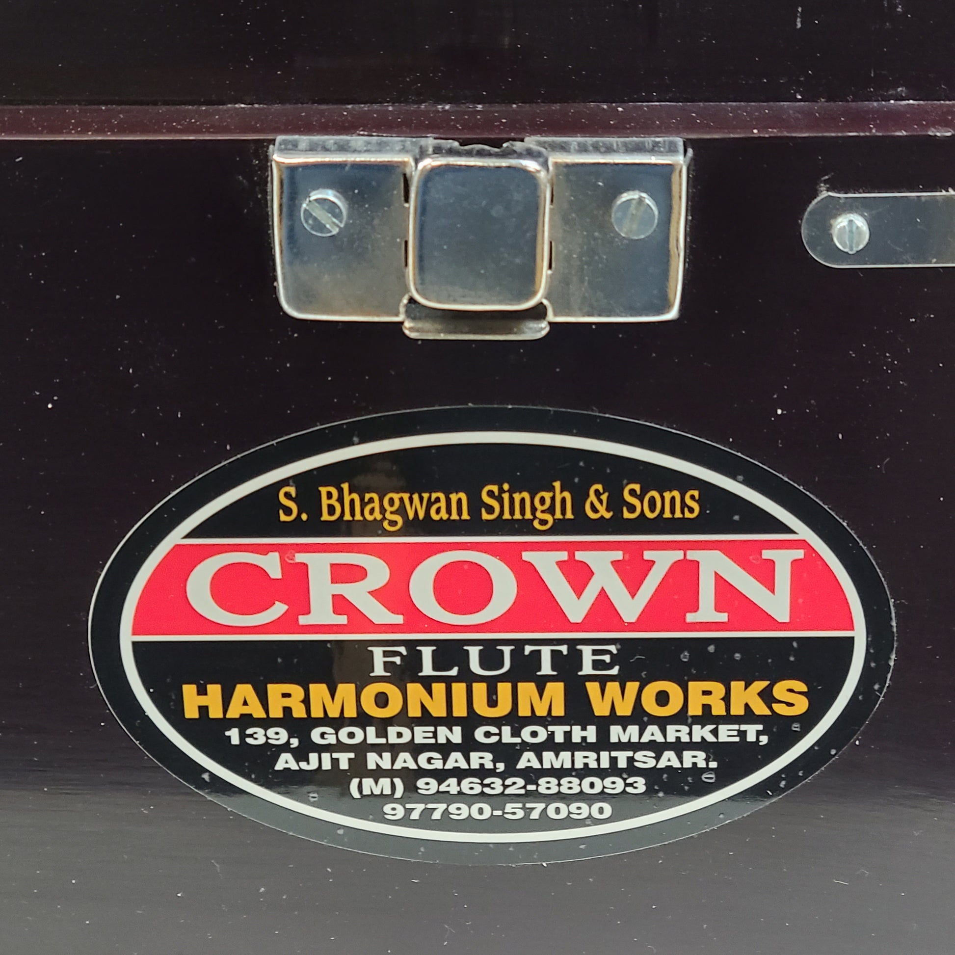 Classic S. Bhagwan Singh & Sons Crown Flute harmonium in black, blue, and brown with a carrying case included.