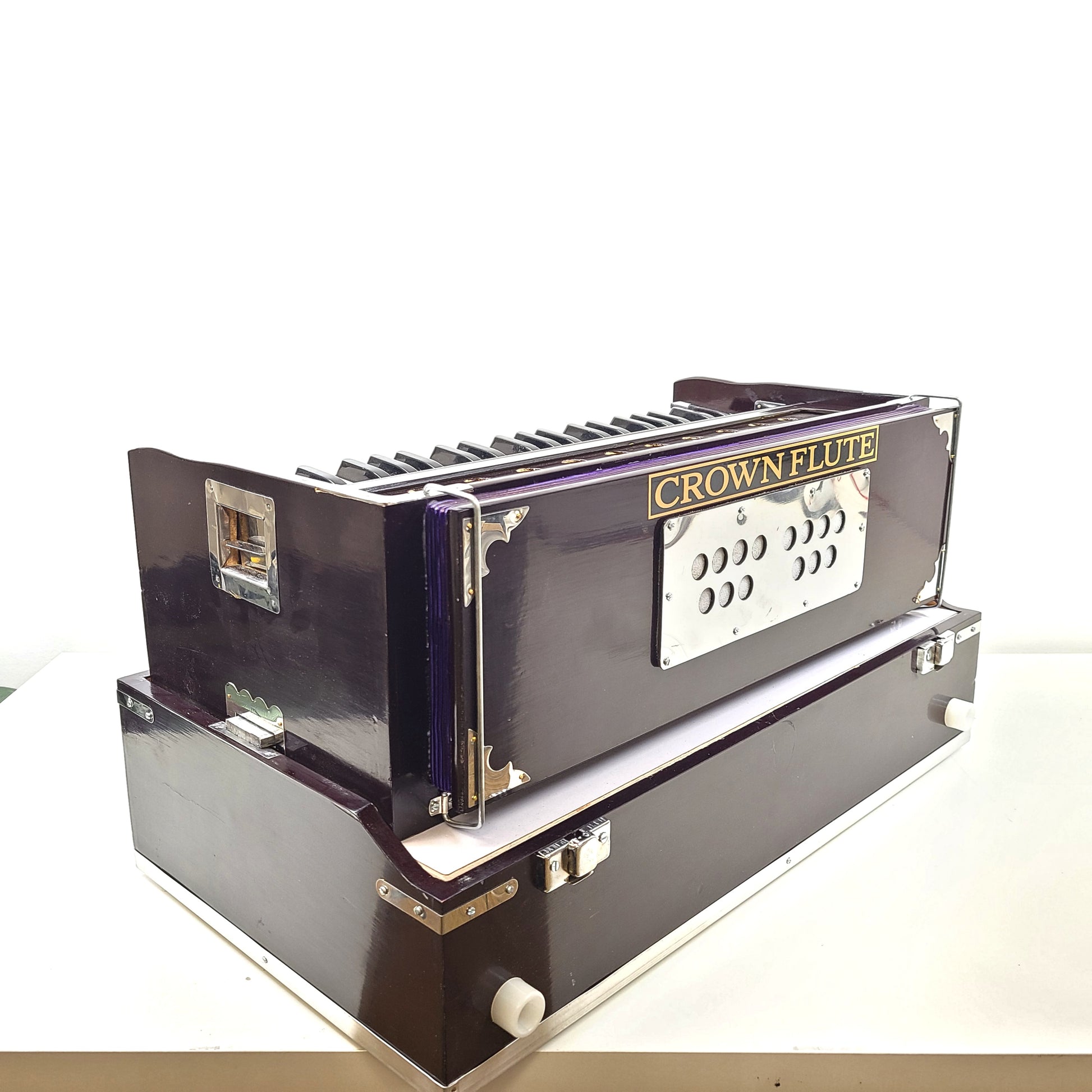 Classic S. Bhagwan Singh & Sons Crown Flute harmonium in black, blue, and brown with a carrying case included.