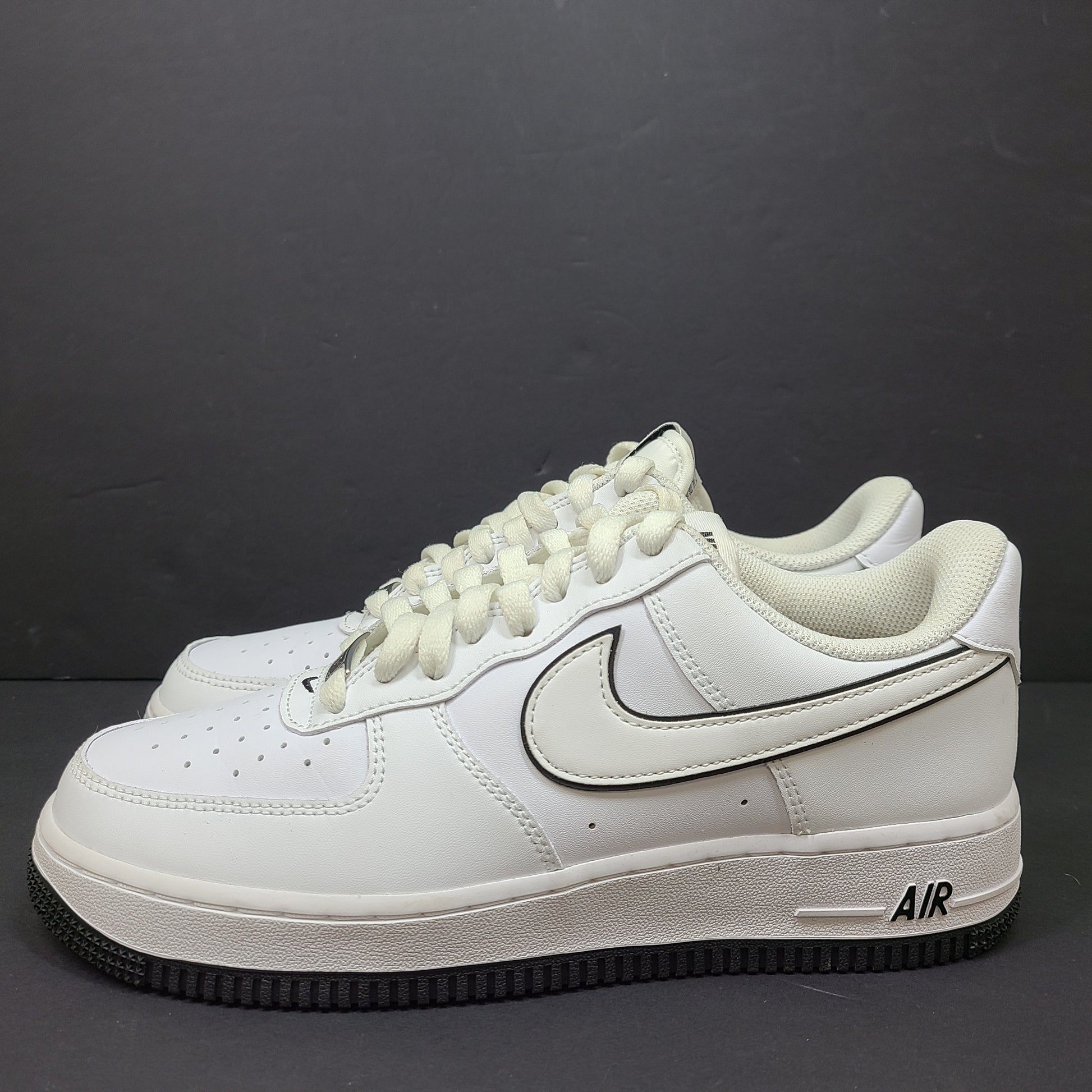 Classic Nike Air Force 1 Low in white with black accents, size US 7.5, model DV0818-103.