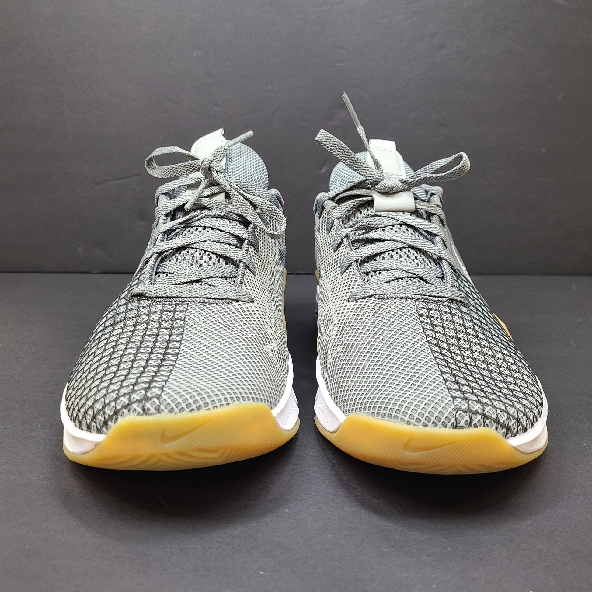 Nike Metcon 8 trainers in gray and yellow deliver stable support and responsive feel for intense training, size US 8.5.