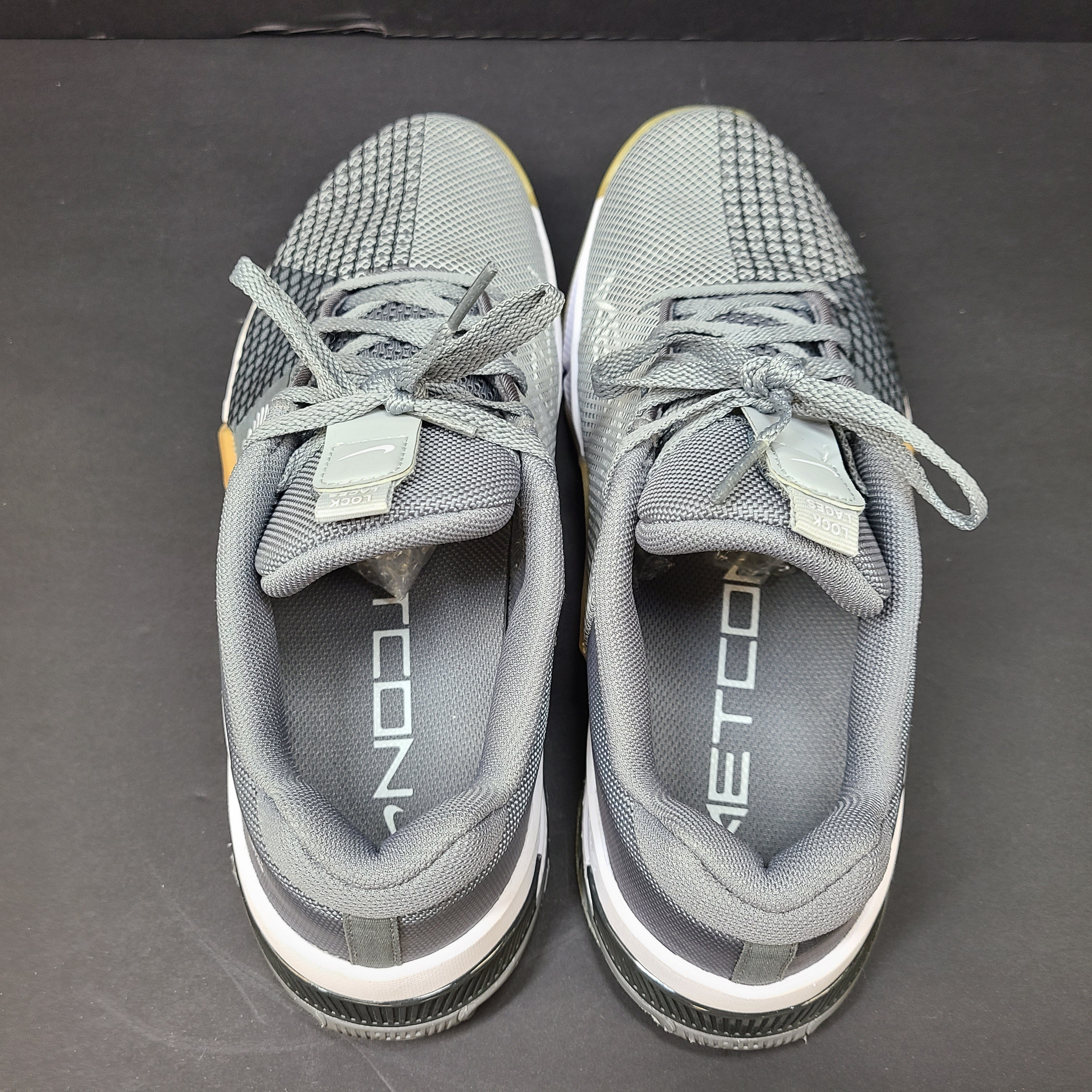 Nike Metcon 8 trainers in gray and yellow deliver stable support and responsive feel for intense training, size US 8.5.