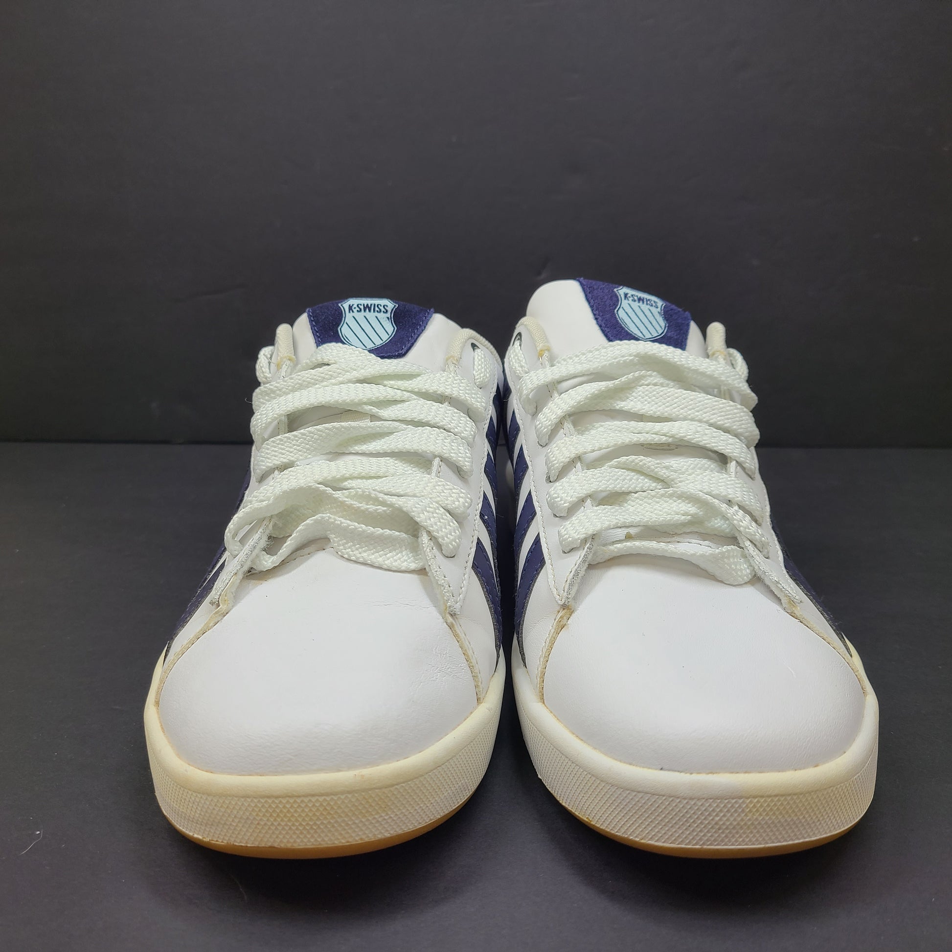 K-Swiss low-top men's sneaker in white and navy with branded tongue and heel.