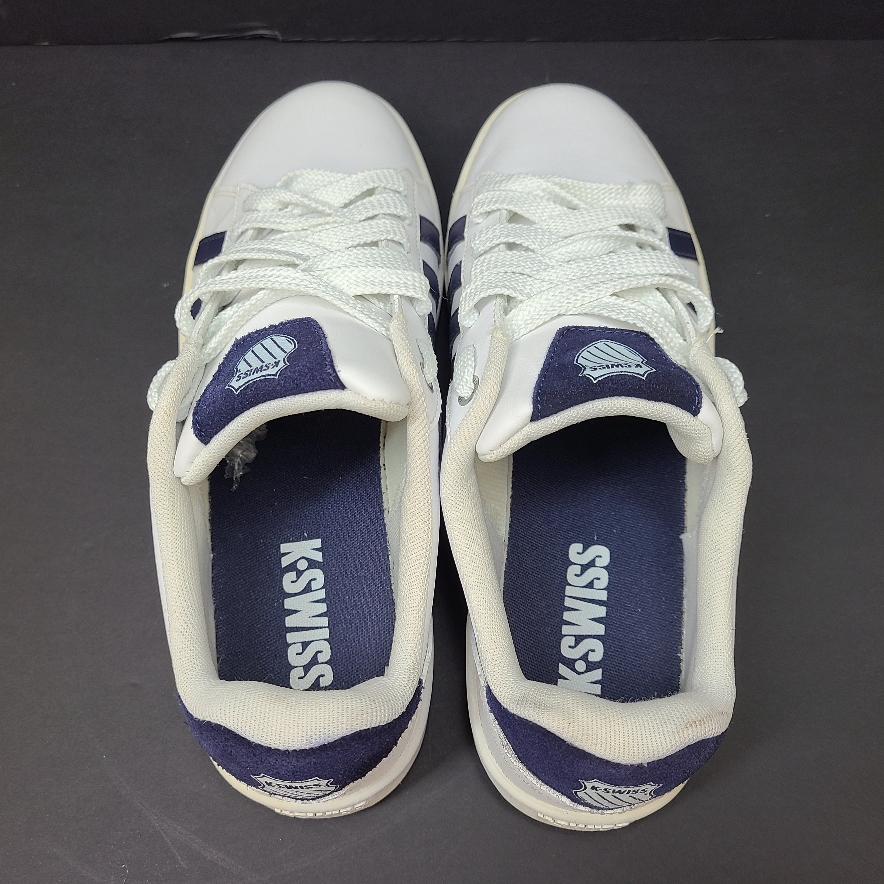 K-Swiss low-top men's sneaker in white and navy with branded tongue and heel.