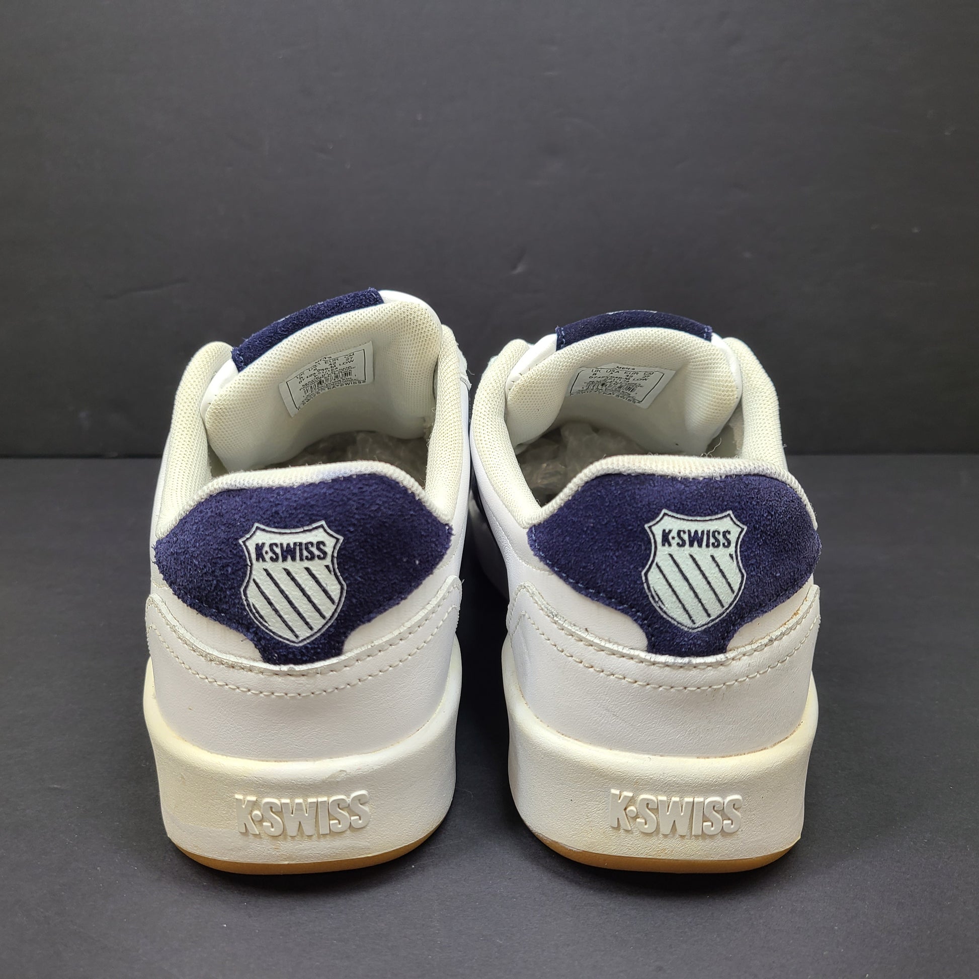 K-Swiss low-top men's sneaker in white and navy with branded tongue and heel.
