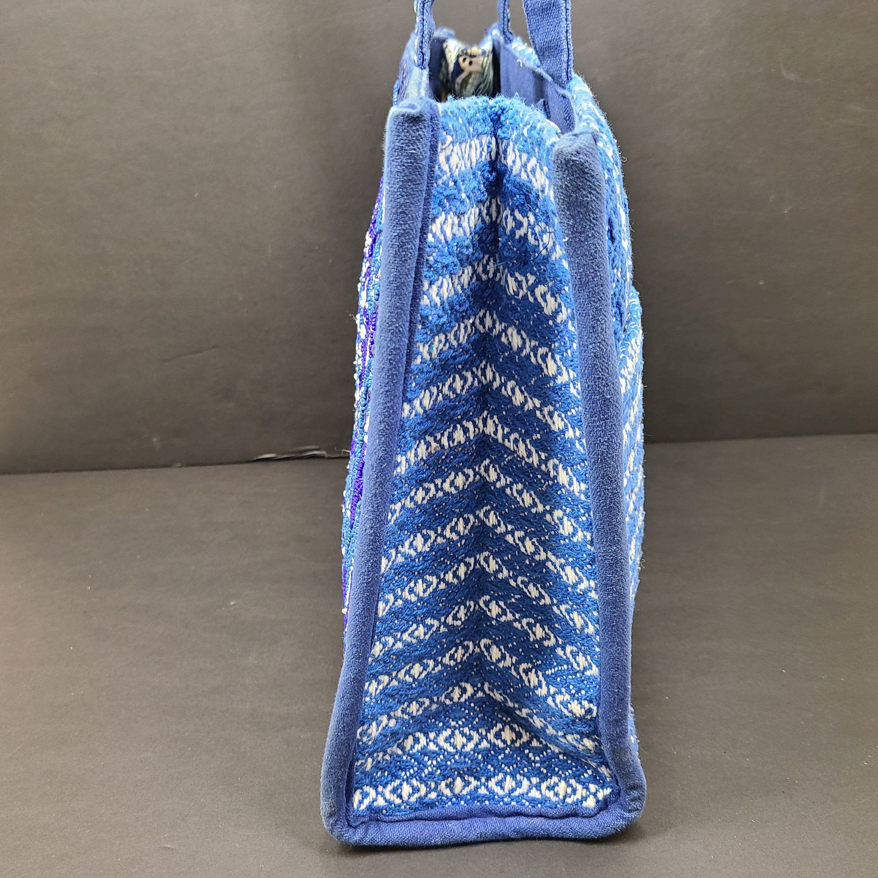 America & Beyond embroidered blue and white tote with floral and leopard interior and interior label reading AMERICA & BEYOND.