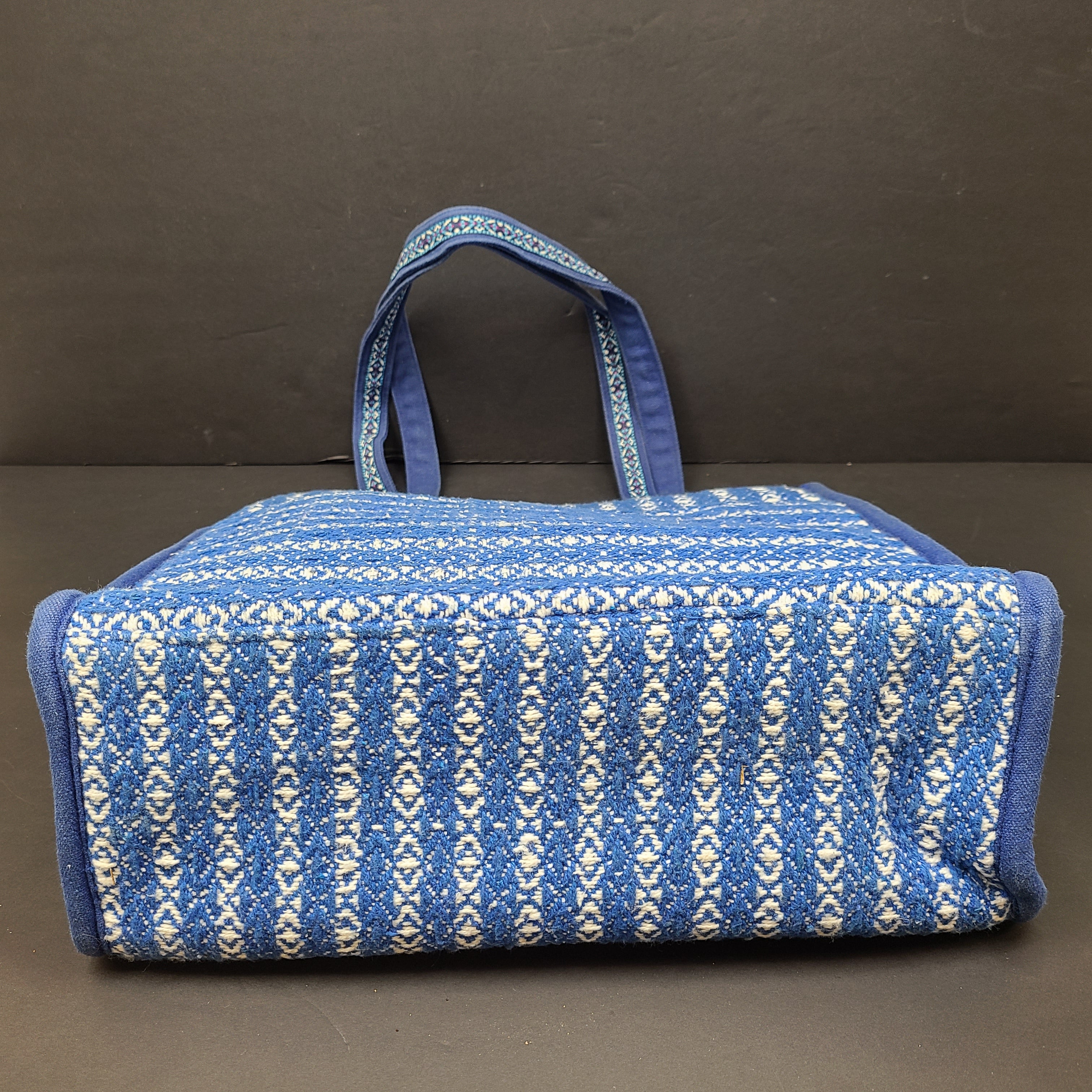 America & Beyond embroidered blue and white tote with floral and leopard interior and interior label reading AMERICA & BEYOND.