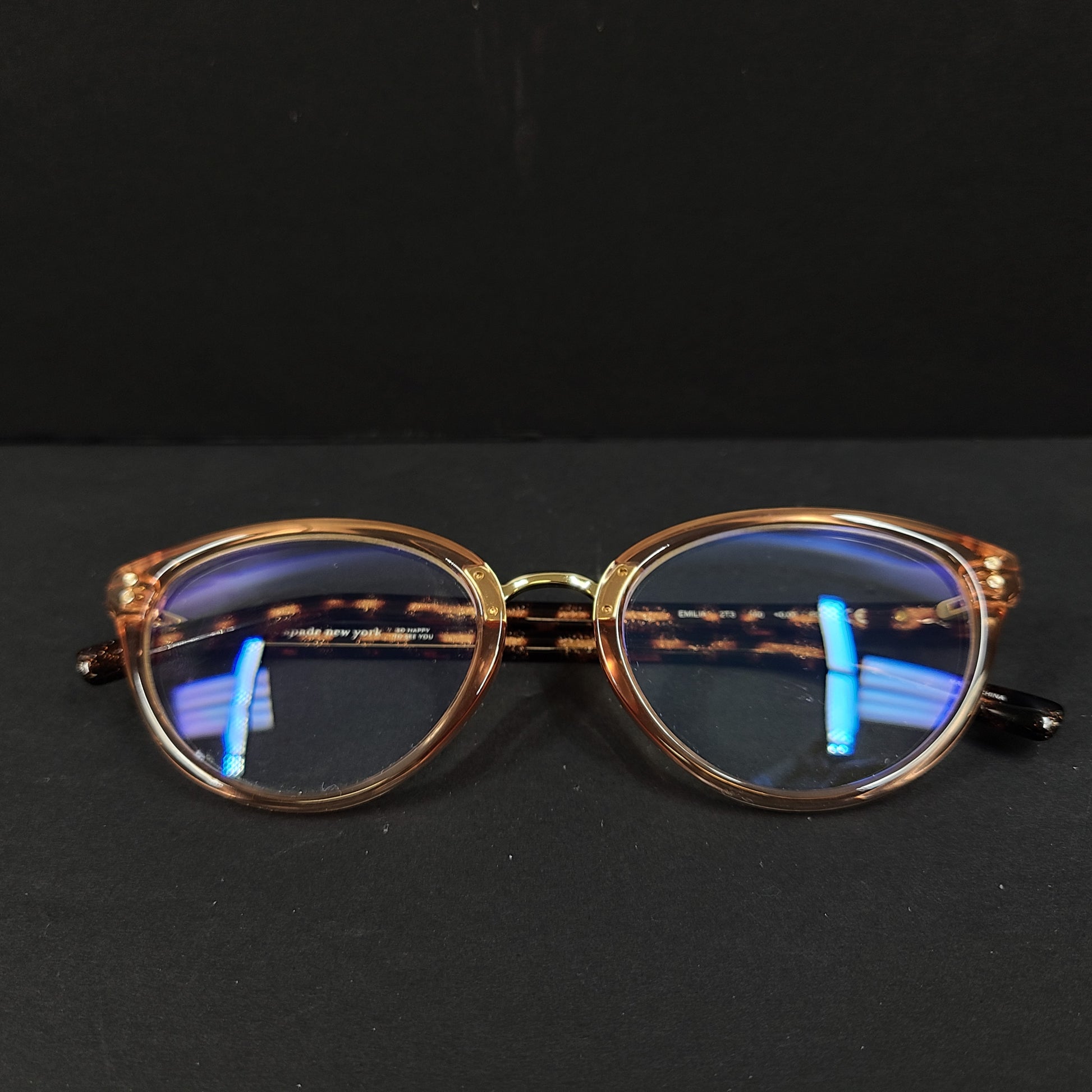 Kate Spade Emilia eyeglasses 2T3 140 in tortoise and peach with a branded arm inscription.