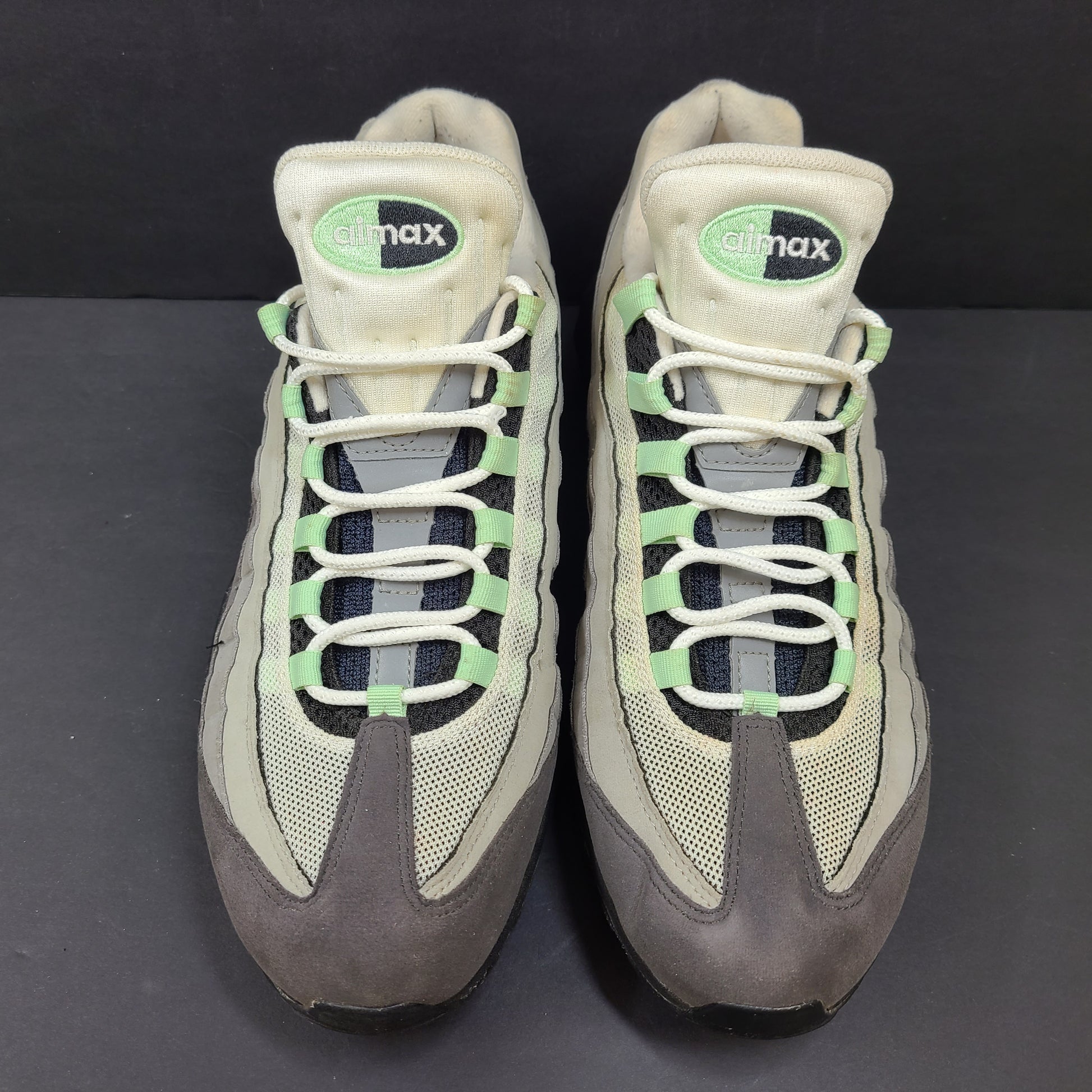 Nike Air Max 95 in gray and mint green, US size 13, with wear on soles and fabric.