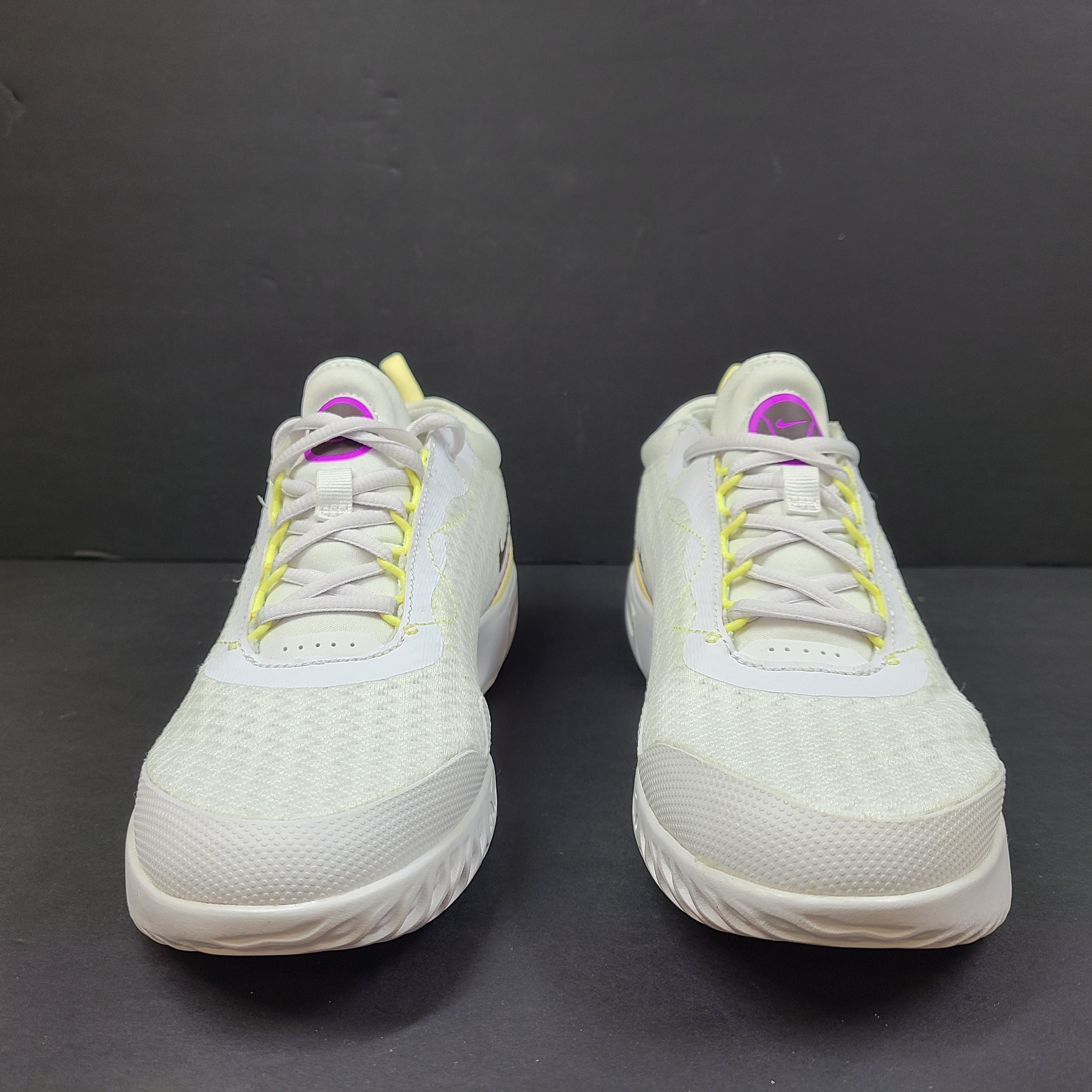 NikeCourt Air Zoom Pro DV3285-101 women's tennis shoes in white, purple, and yellow with a low-profile performance design.