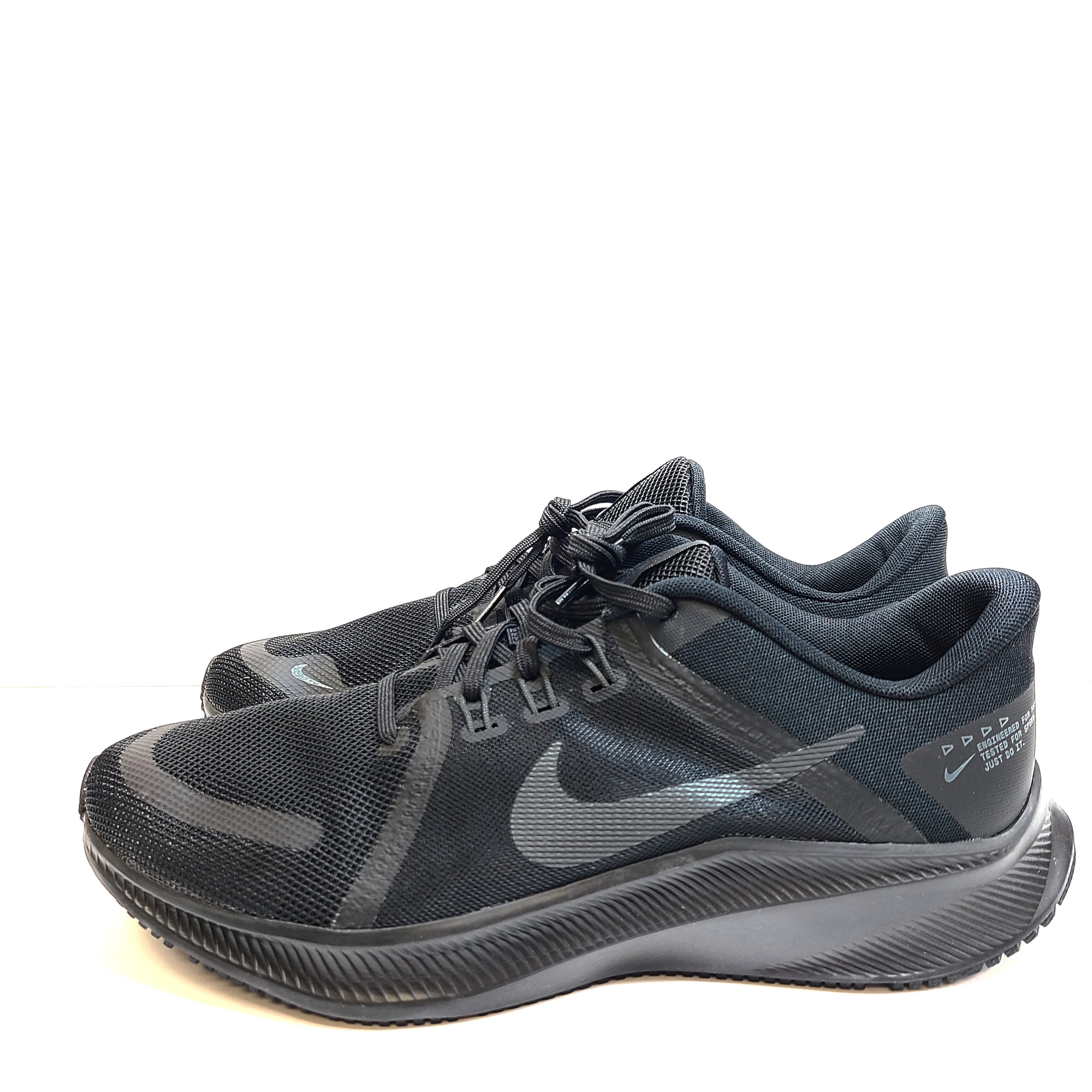 A black Nike Quest 4 running shoe in men's US 10 with breathable mesh upper and cushioned sole.