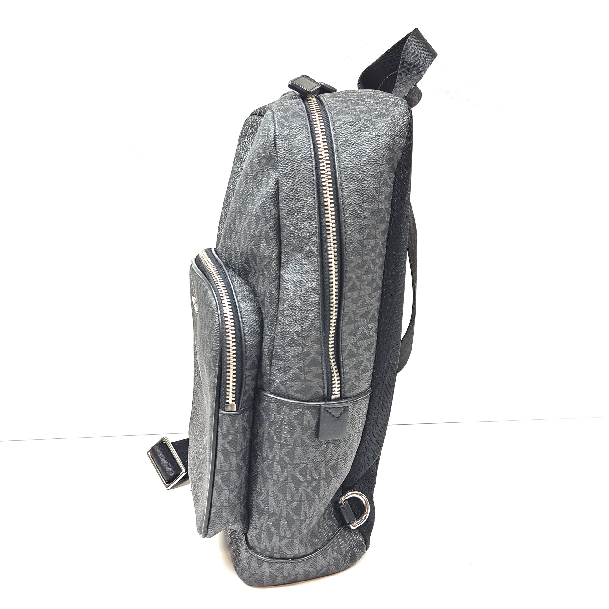 A grey Michael Kors backpack model 1239NHNP with leather finish and a structured silhouette.