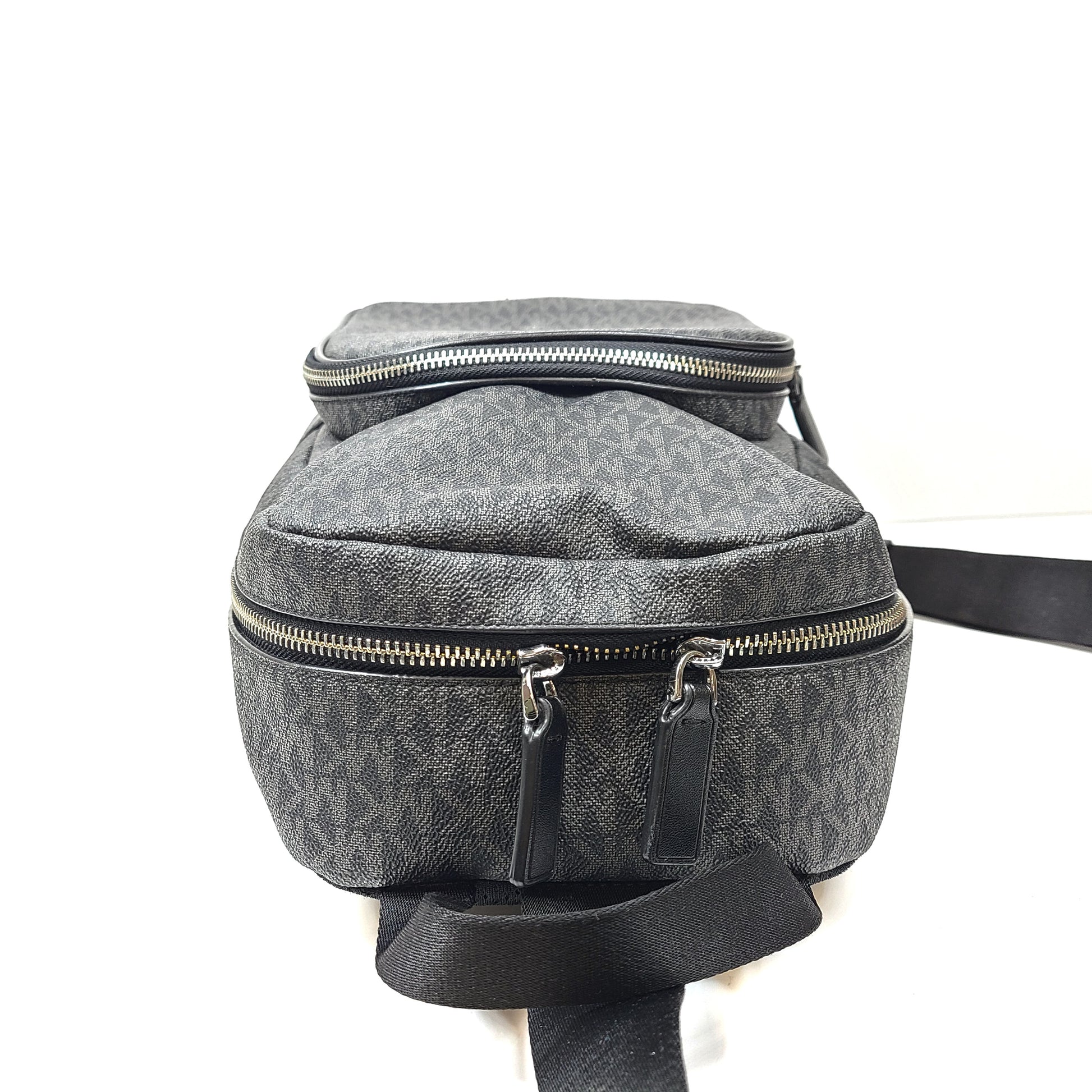 A grey Michael Kors backpack model 1239NHNP with leather finish and a structured silhouette.