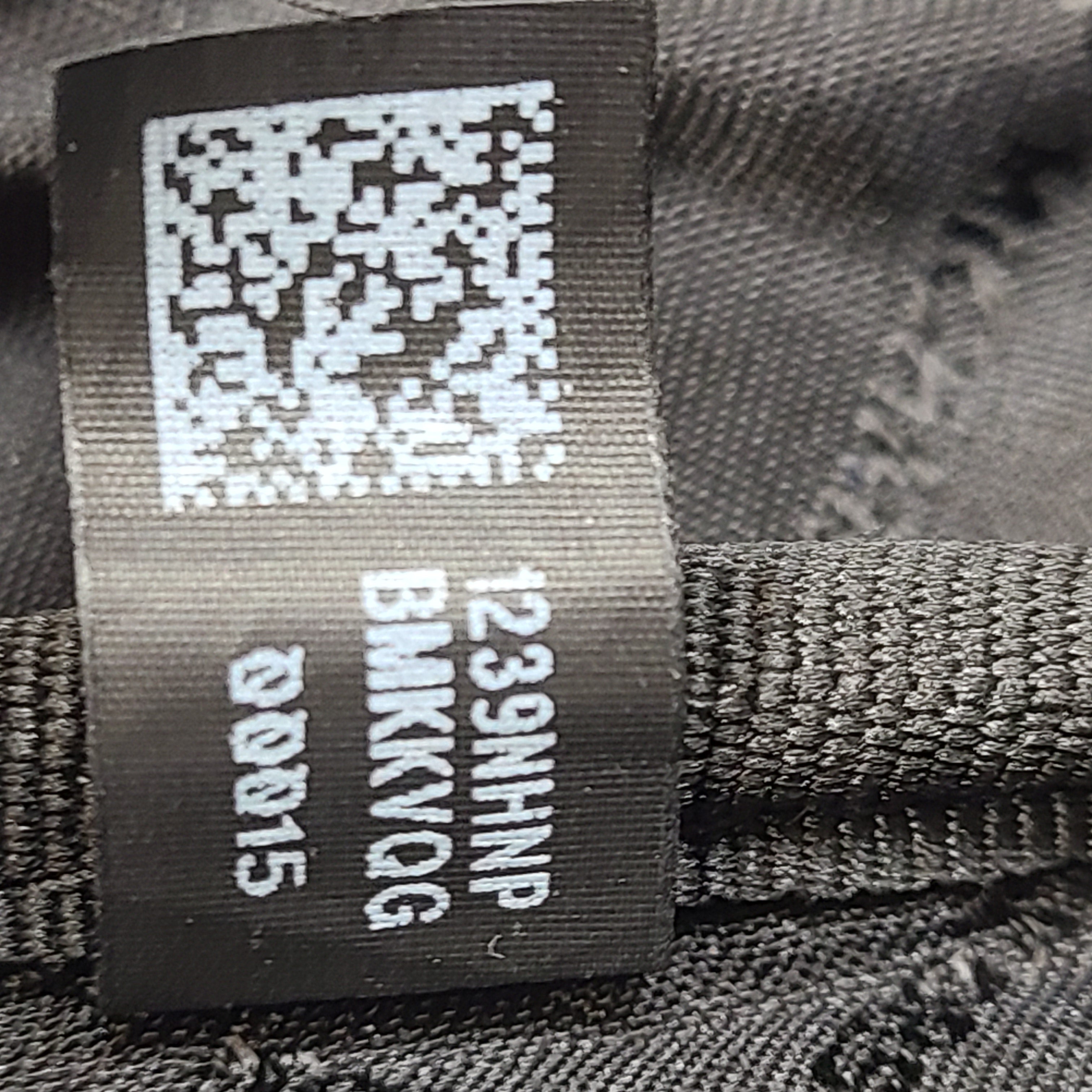 A grey Michael Kors backpack model 1239NHNP with leather finish and a structured silhouette.