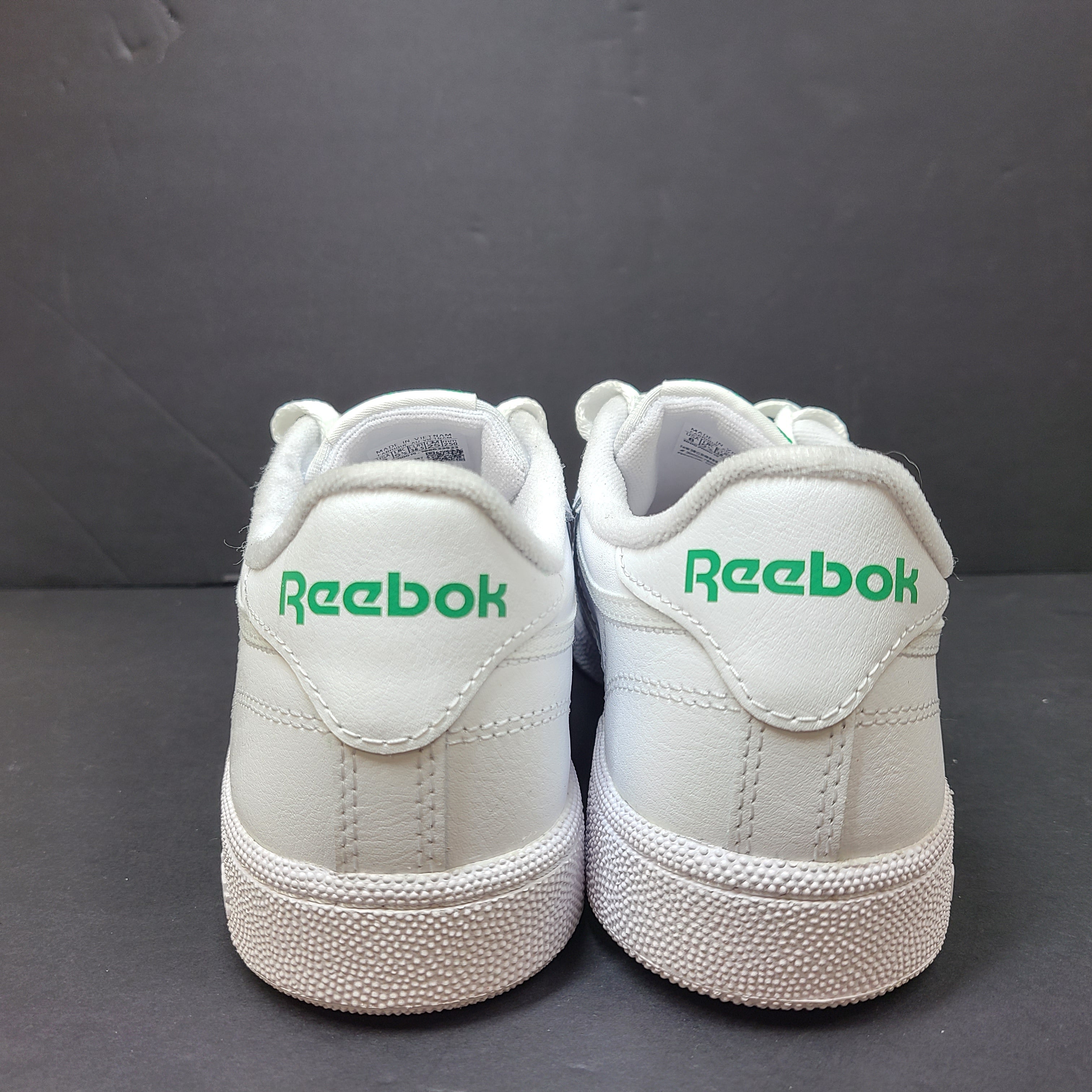 White Reebok Classic low-top sneakers in US size 8 with minimal wear and slight interior lining markings.