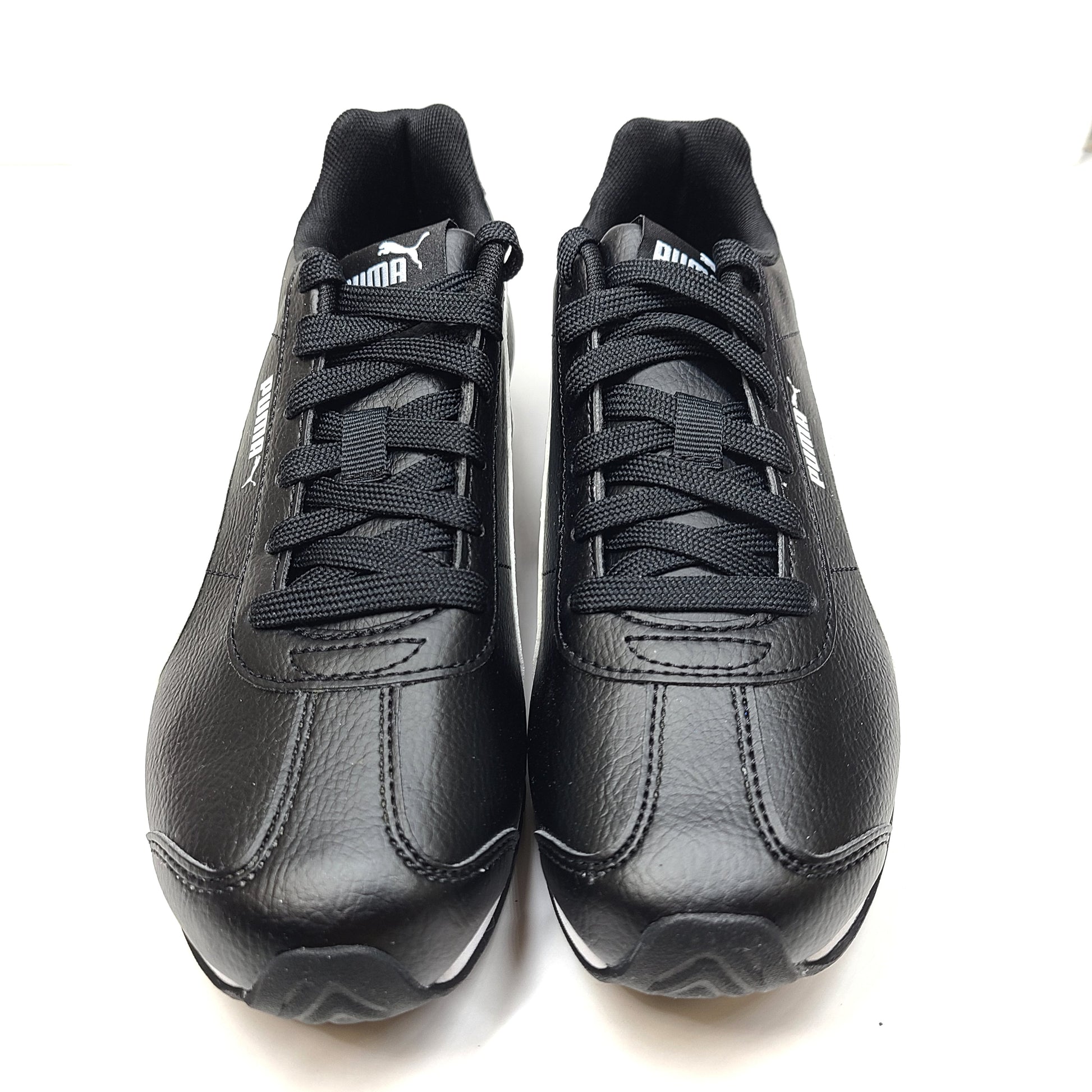 Black and white Puma Turin 3 GS kids' sneakers deliver lightweight comfort and classic styling for active days.