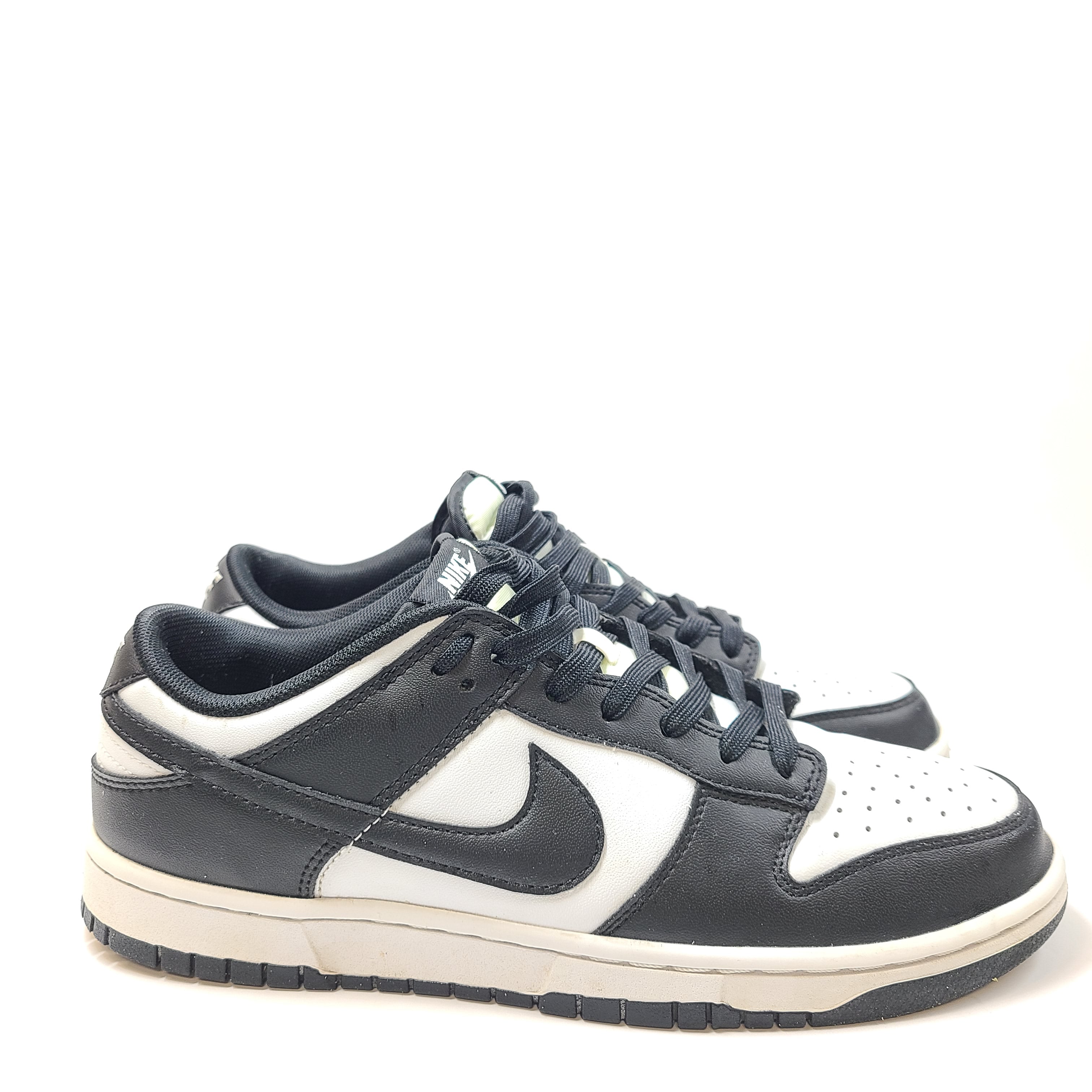 Nike Dunk Low Retro in black and white with a low-cut profile and leather overlays.