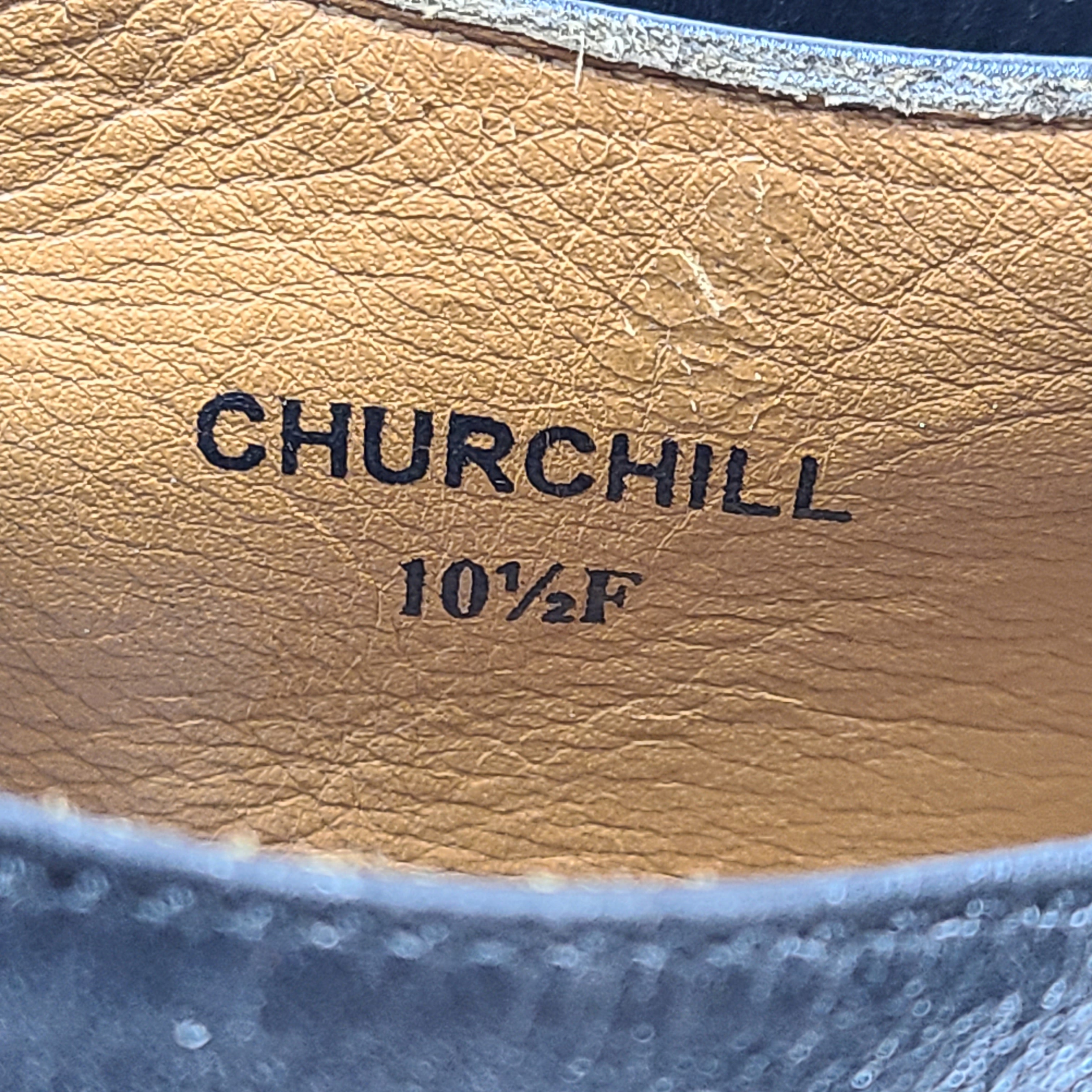 A black leather monk strap men's dress shoe in size 10.5F labeled Churchill.