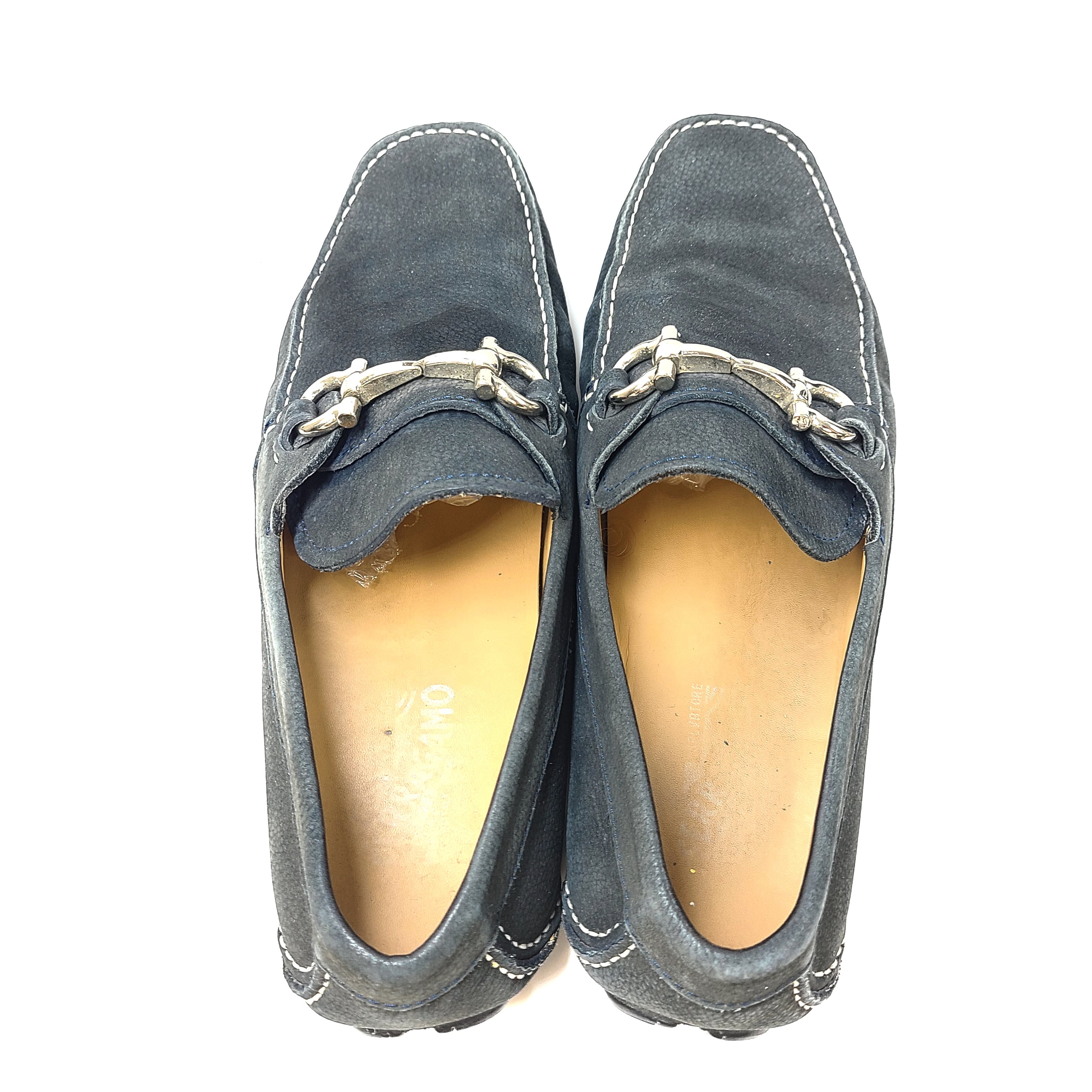 Blue Ferragamo men's leather loafers with slip-on design and Italian-made sole.