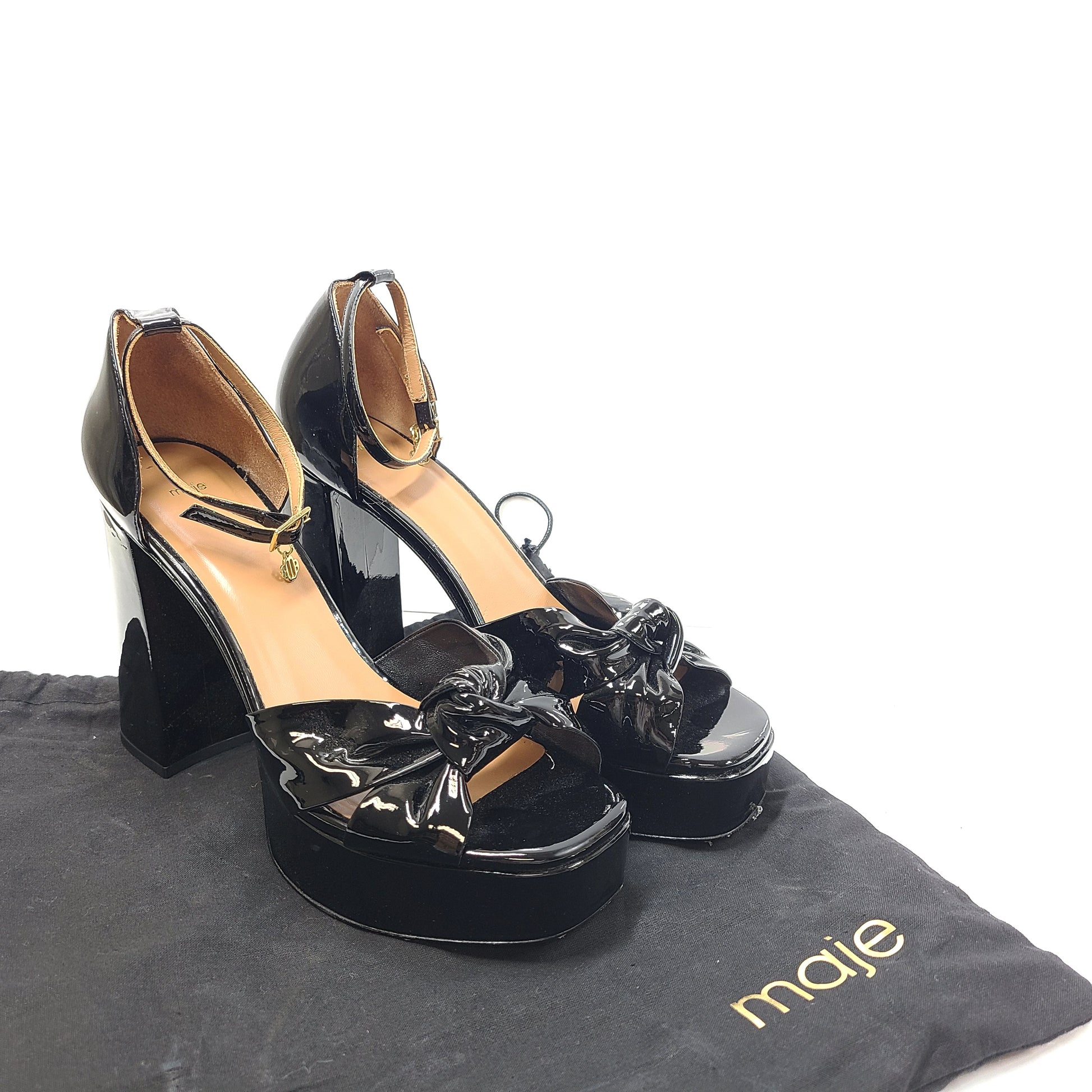 Black patent leather high-heel sandals feature a slender stiletto and platform, size 40, origin Portugal.