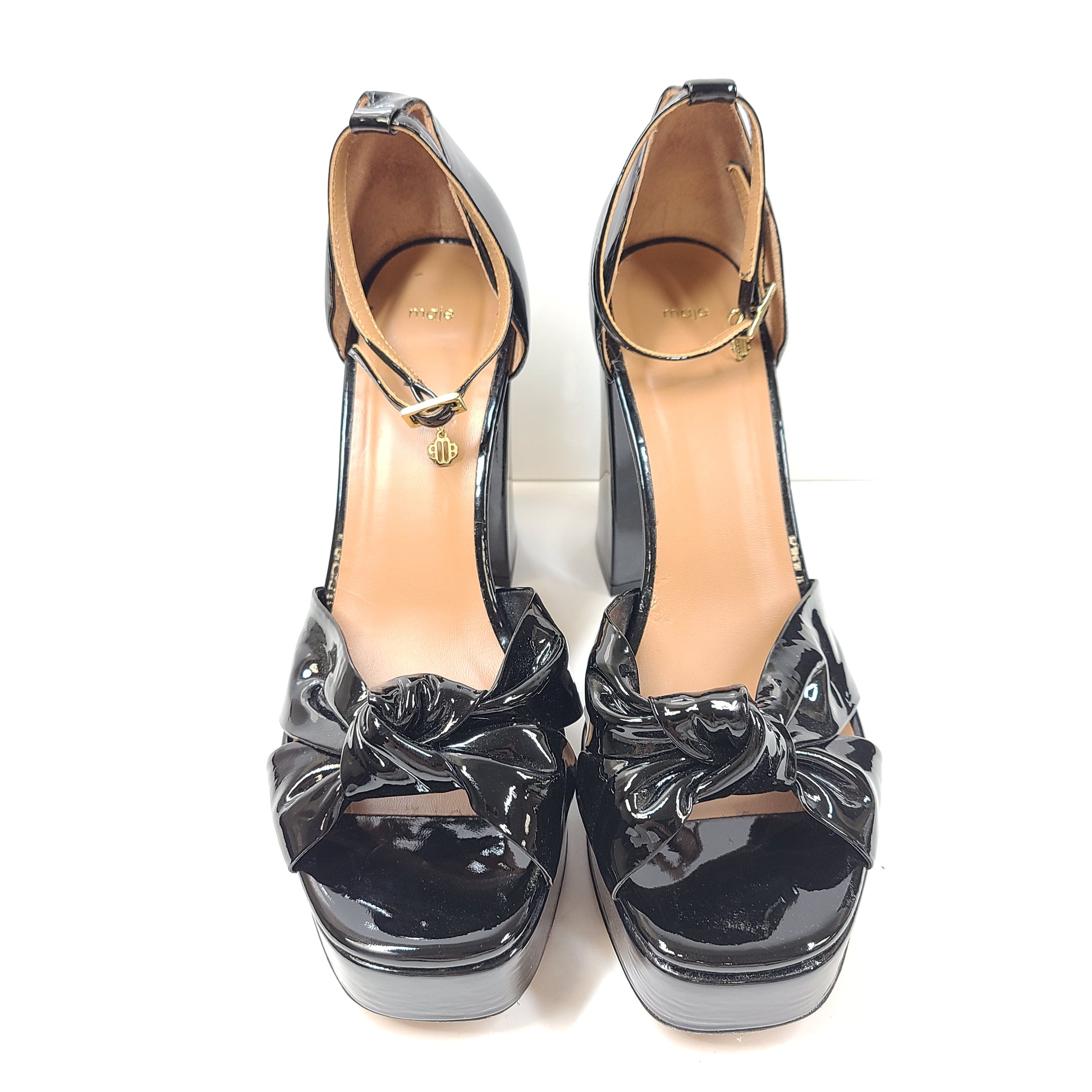 Black patent leather high-heel sandals feature a slender stiletto and platform, size 40, origin Portugal.