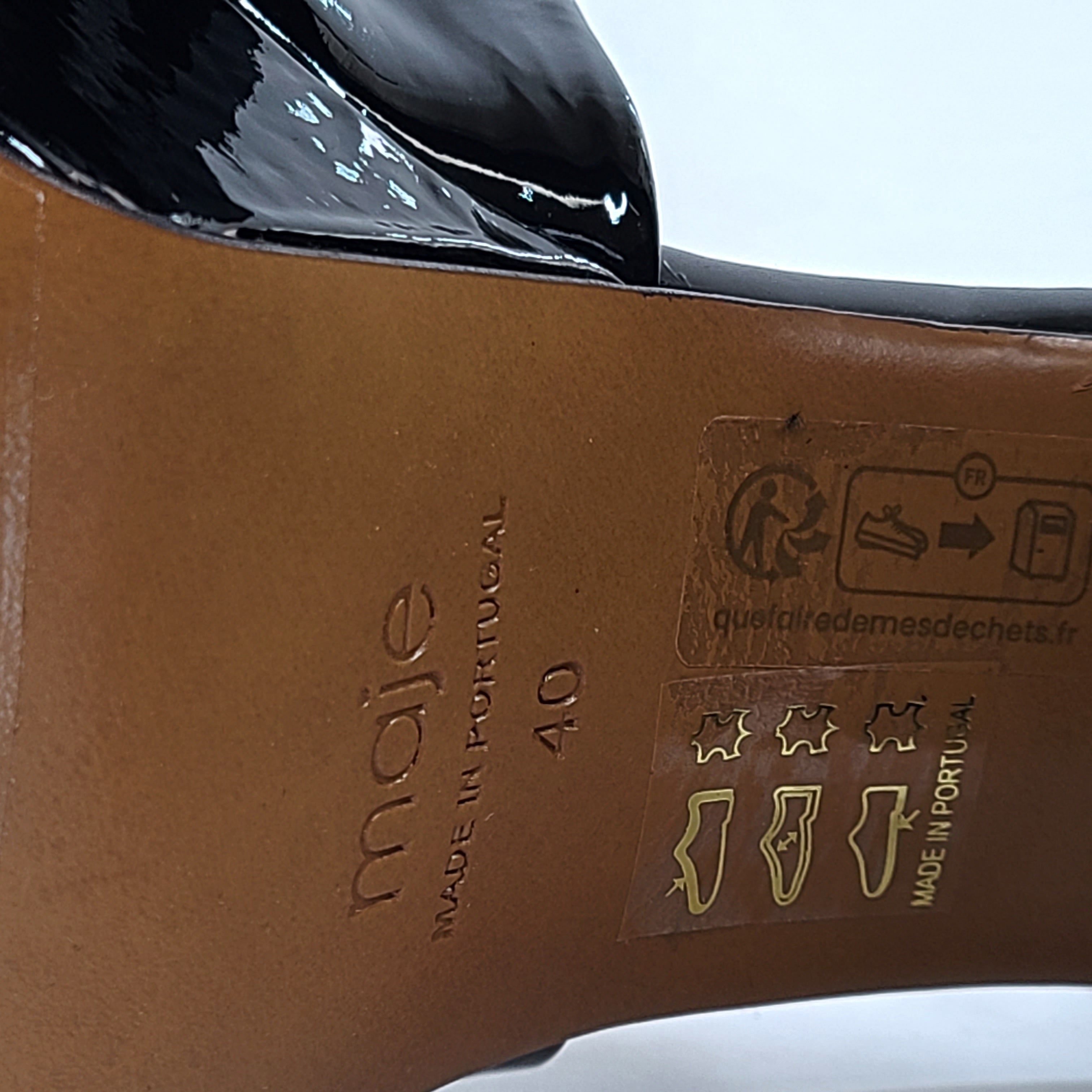 Black patent leather high-heel sandals feature a slender stiletto and platform, size 40, origin Portugal.