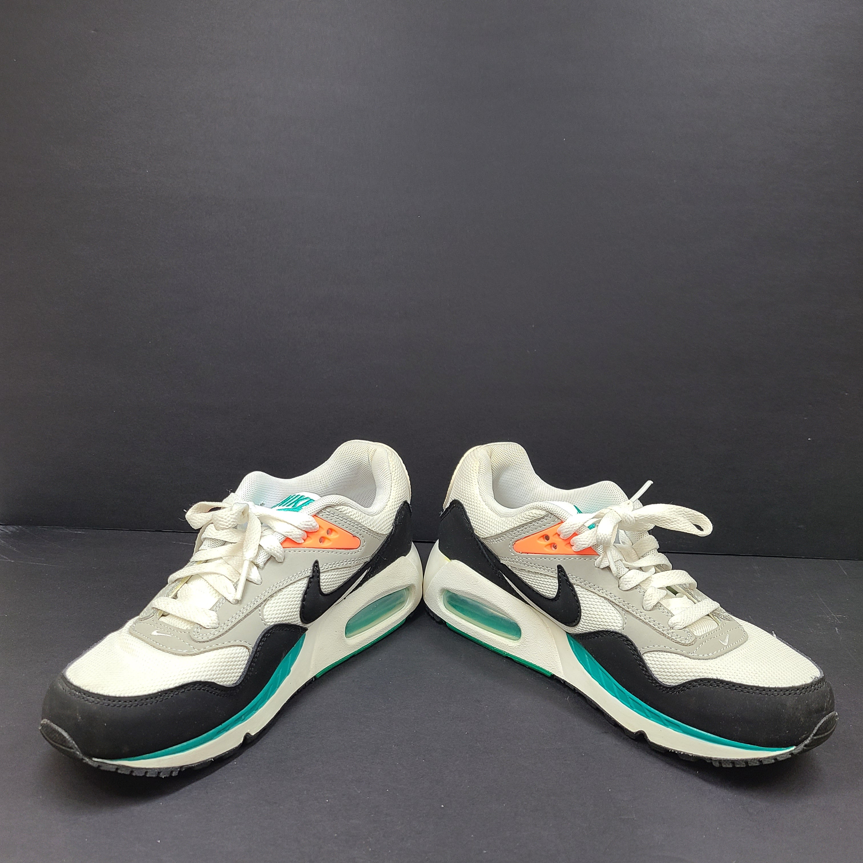 Nike Air Max Correlate in white, black and orange with Air Max cushioning and a low-top silhouette.