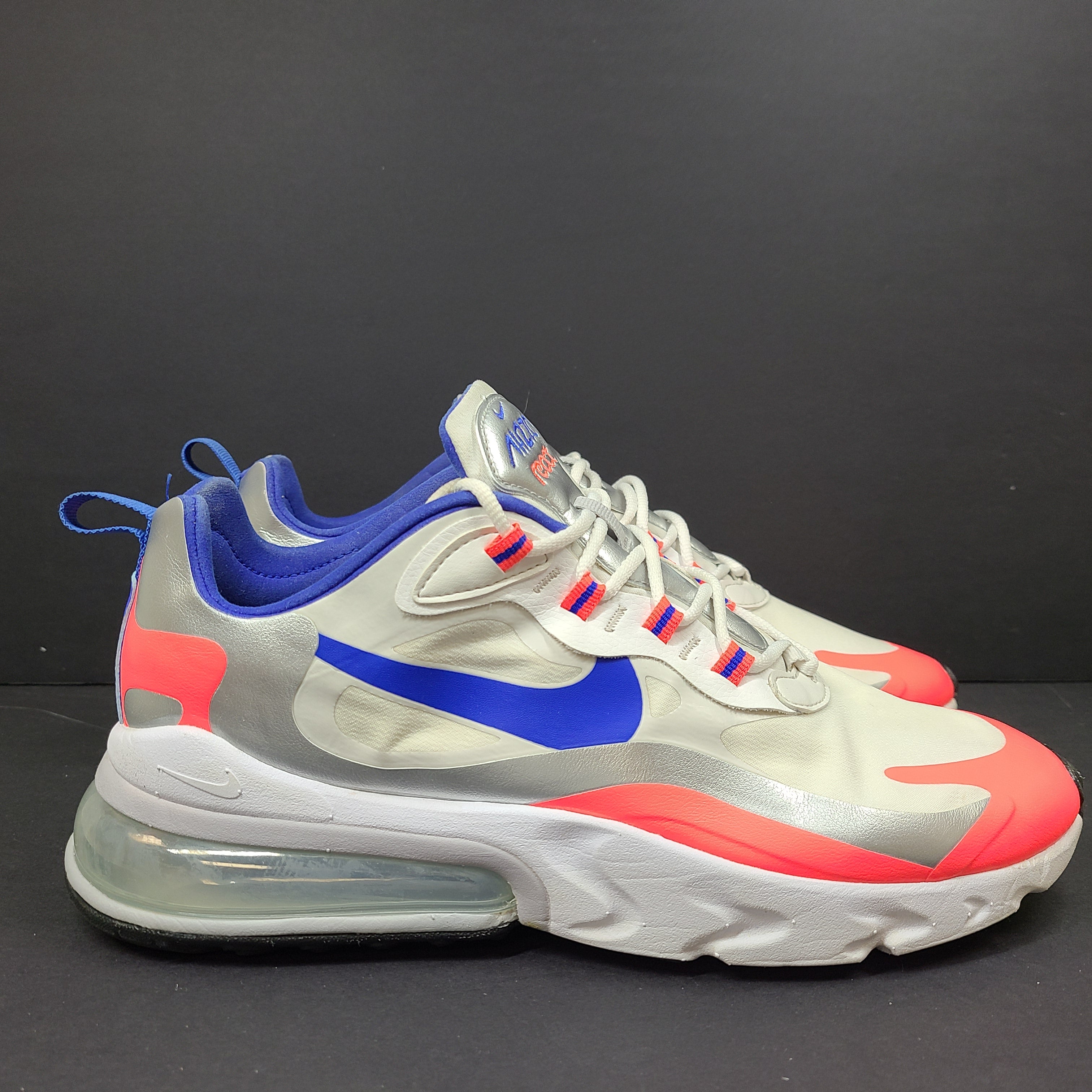 Nike Air Max 270 React US 10.5 in gray, blue and red, pre-owned with light wear.