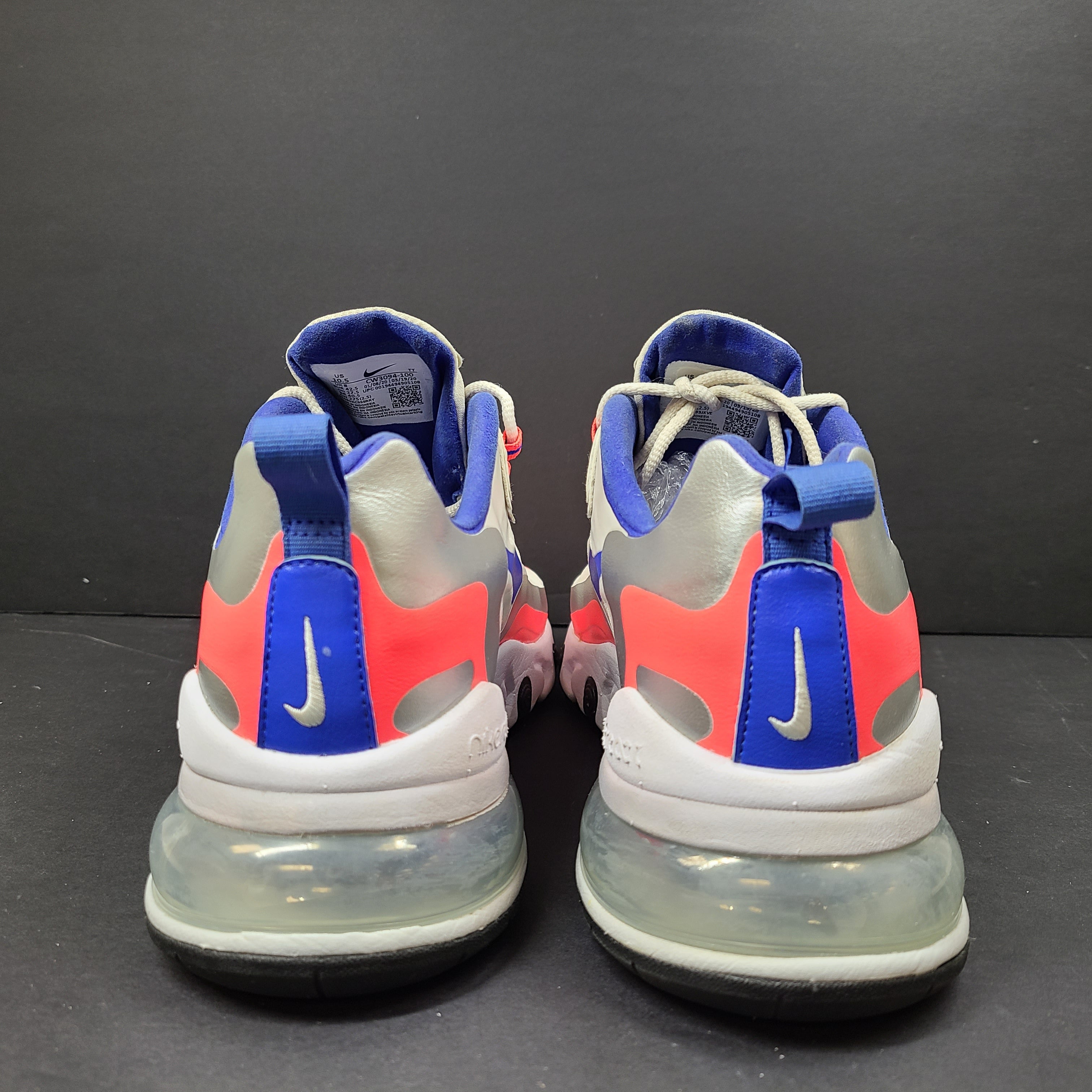 Nike Air Max 270 React US 10.5 in gray, blue and red, pre-owned with light wear.