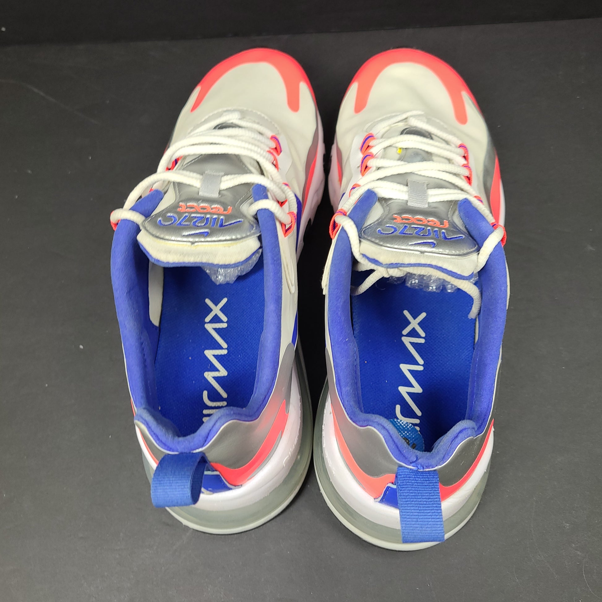 Nike Air Max 270 React US 10.5 in gray, blue and red, pre-owned with light wear.